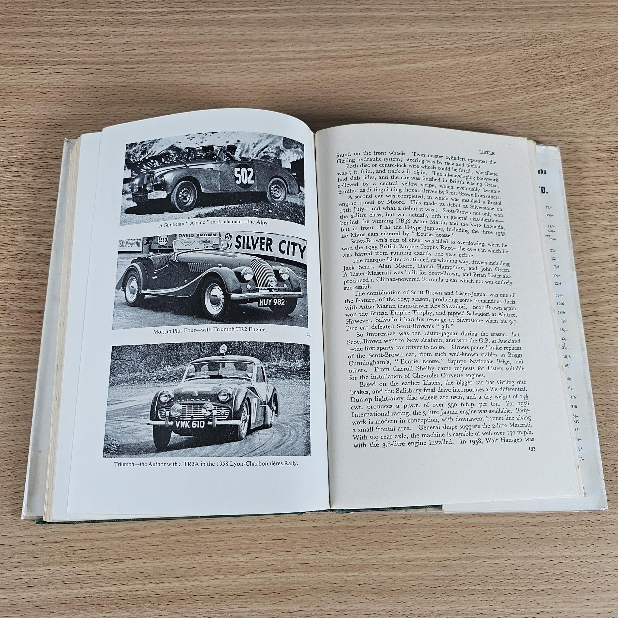 Open book spread with black-and-white vintage sports car photos and text