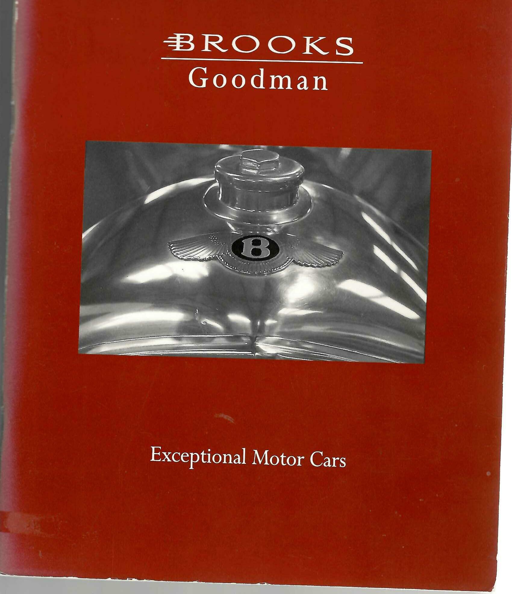 Red paperback auction catalogue with Brooks Goodman logo and “Exceptional Motor Cars” cover
