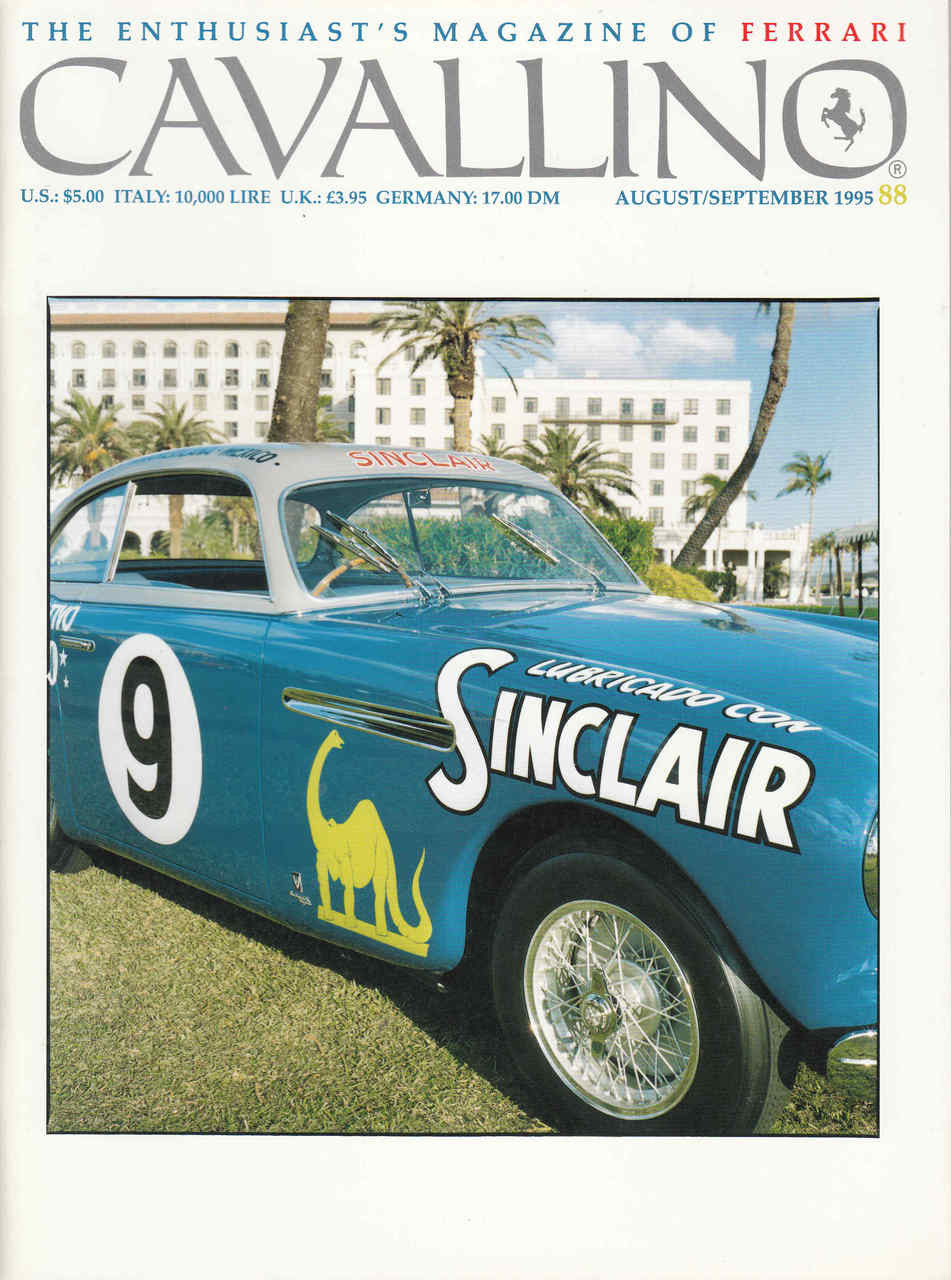 Car racing magazine cover featuring a blue Ferrari-style race car with number 9