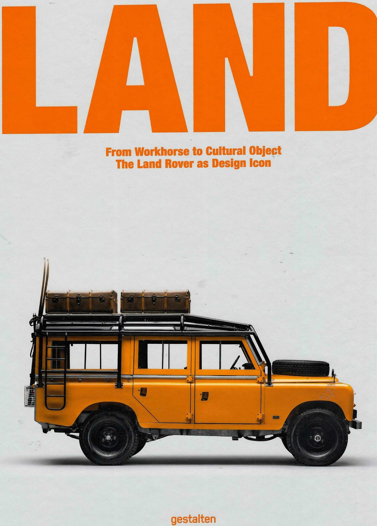 Land Rover book cover with orange vehicle and bold title text