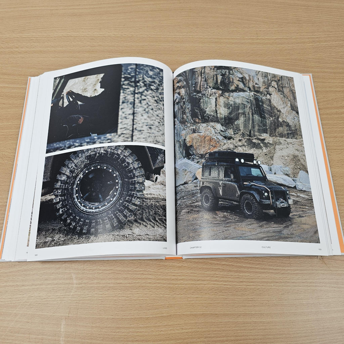 Open photo book spread with off-road vehicle images on both pages