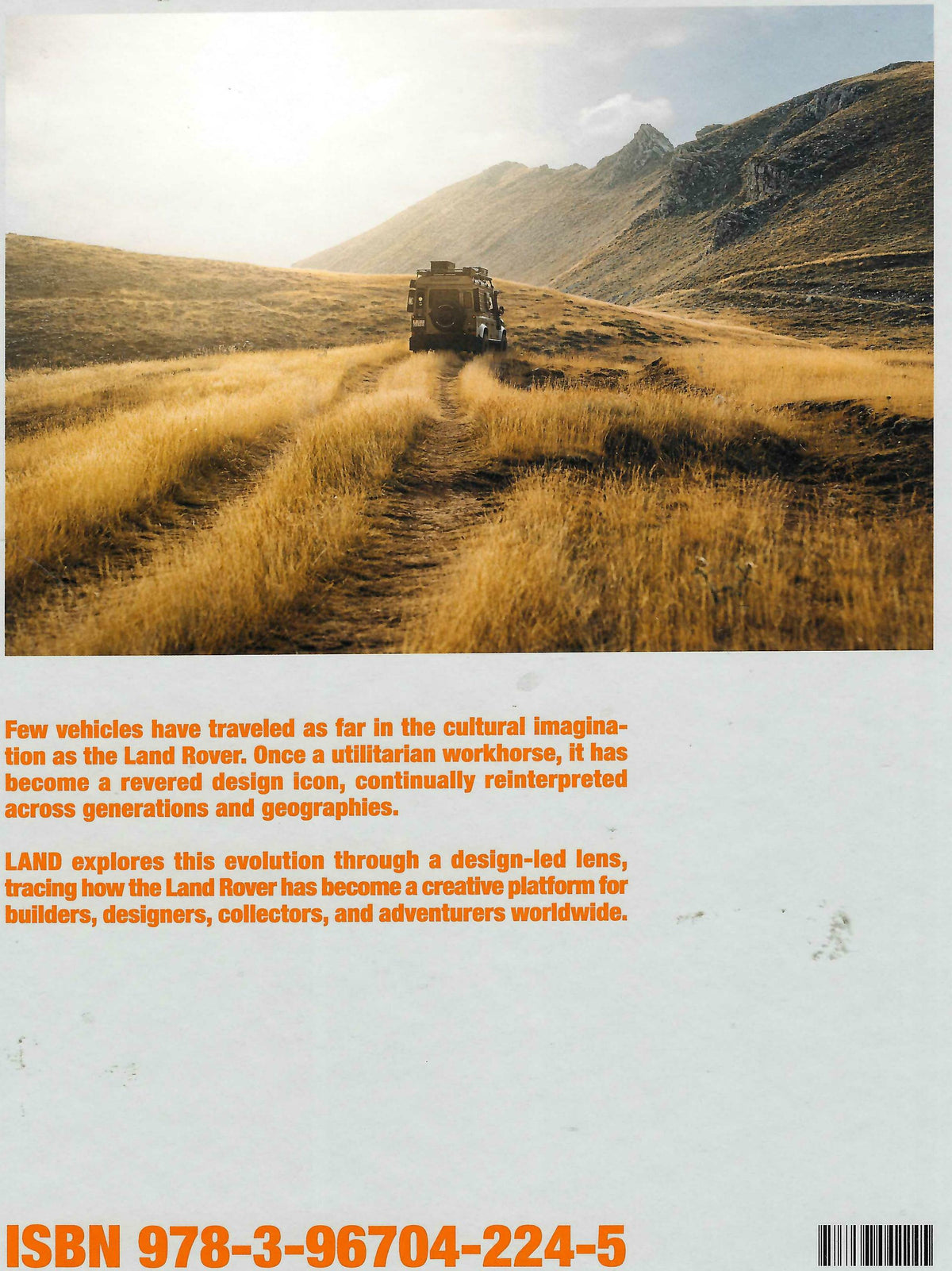 Land Rover book back cover with landscape photo, text, and ISBN barcode