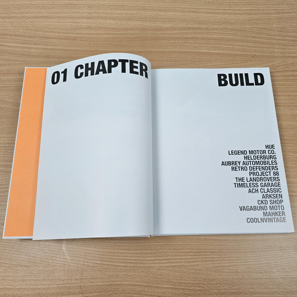 Open Land Rover book page with “01 CHAPTER” and “BUILD” section text