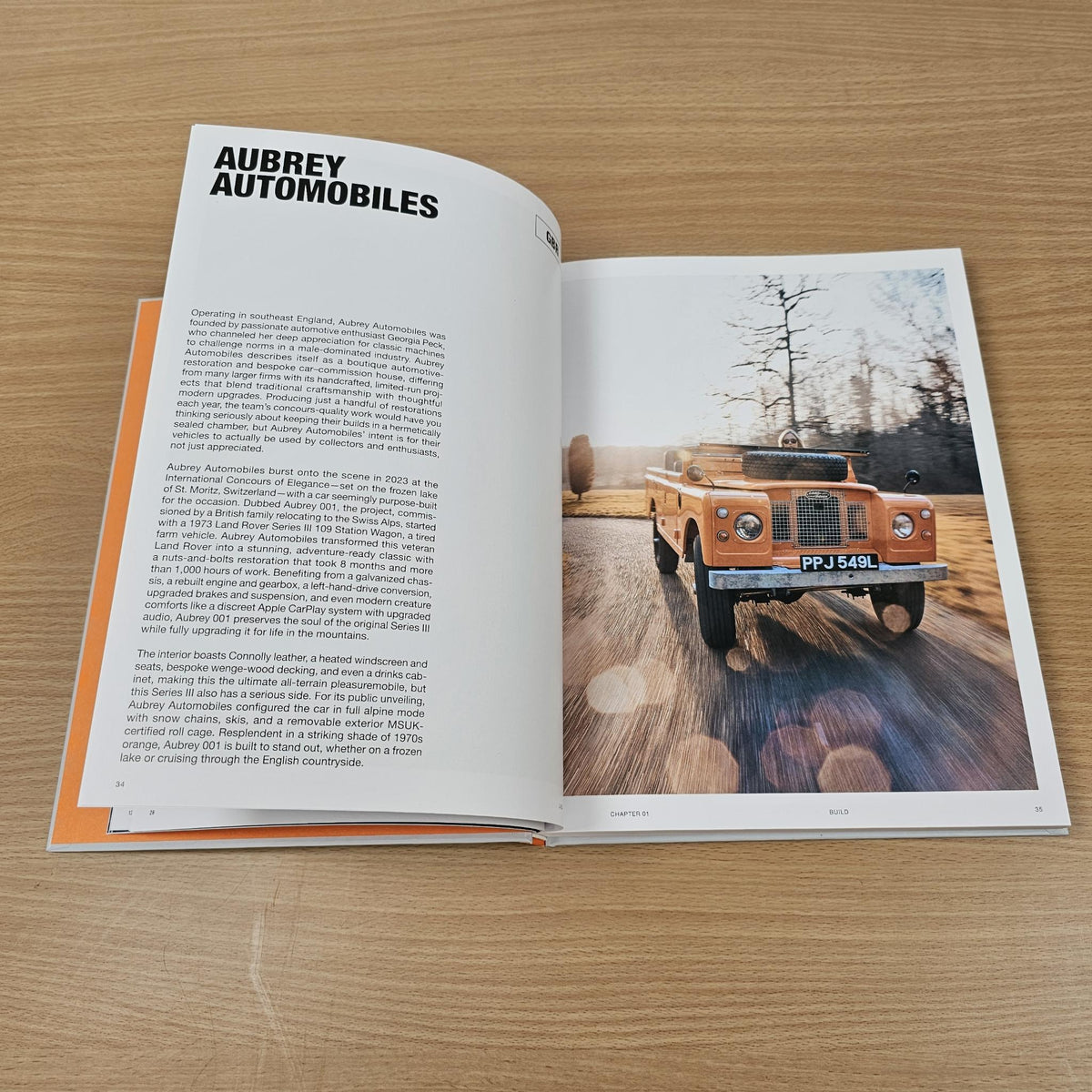 Open Land Rover book page titled “Aubrey Automobiles” with truck photo