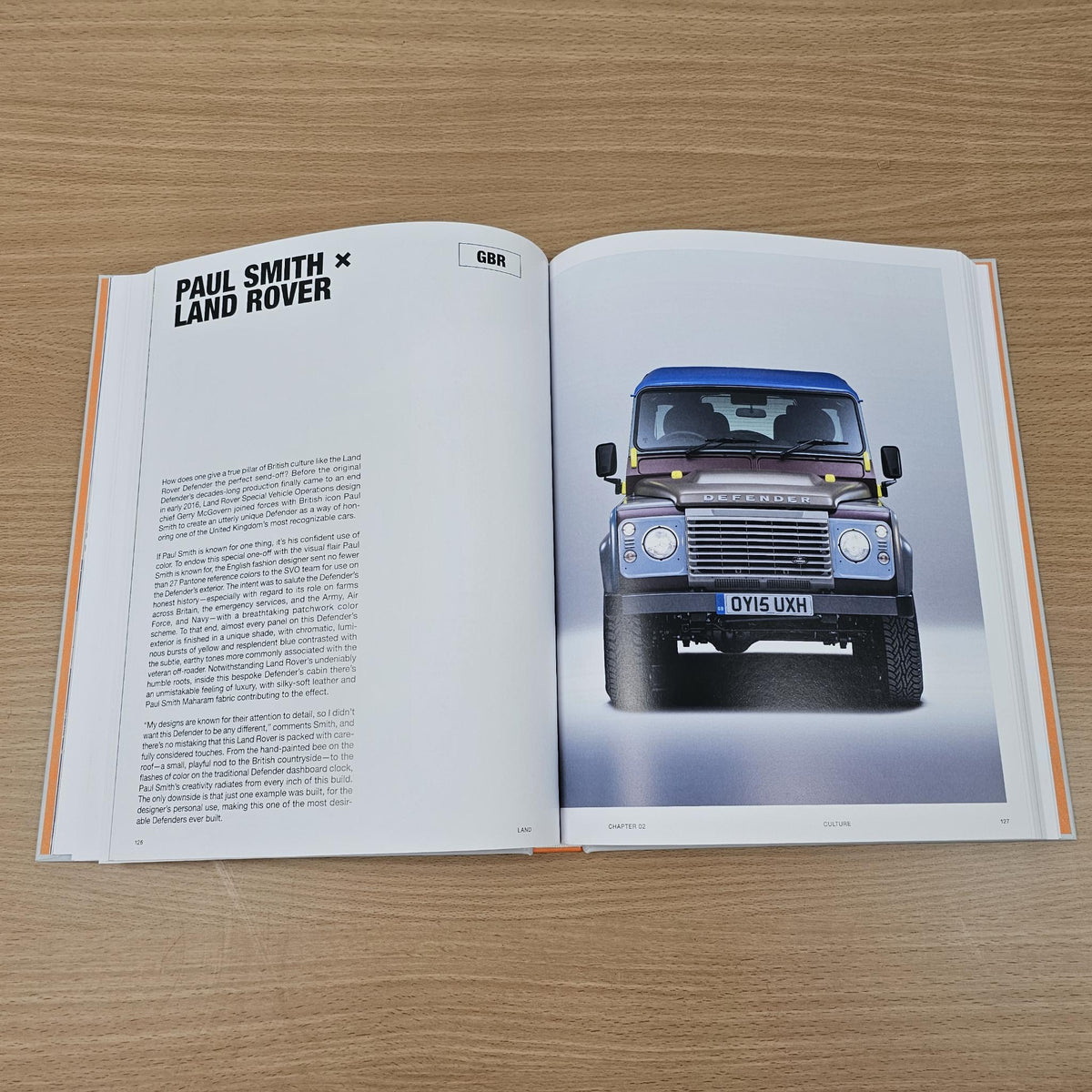 Open Land Rover book page titled “Paul Smith” with front view blue truck