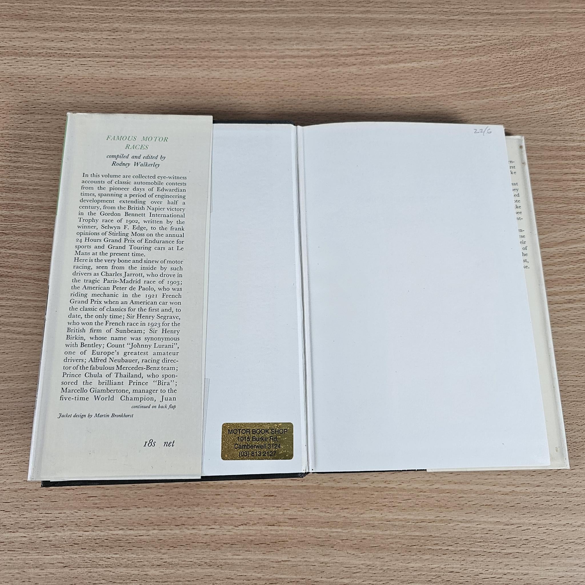 Vintage book open flat, showing printed pages and a small price label