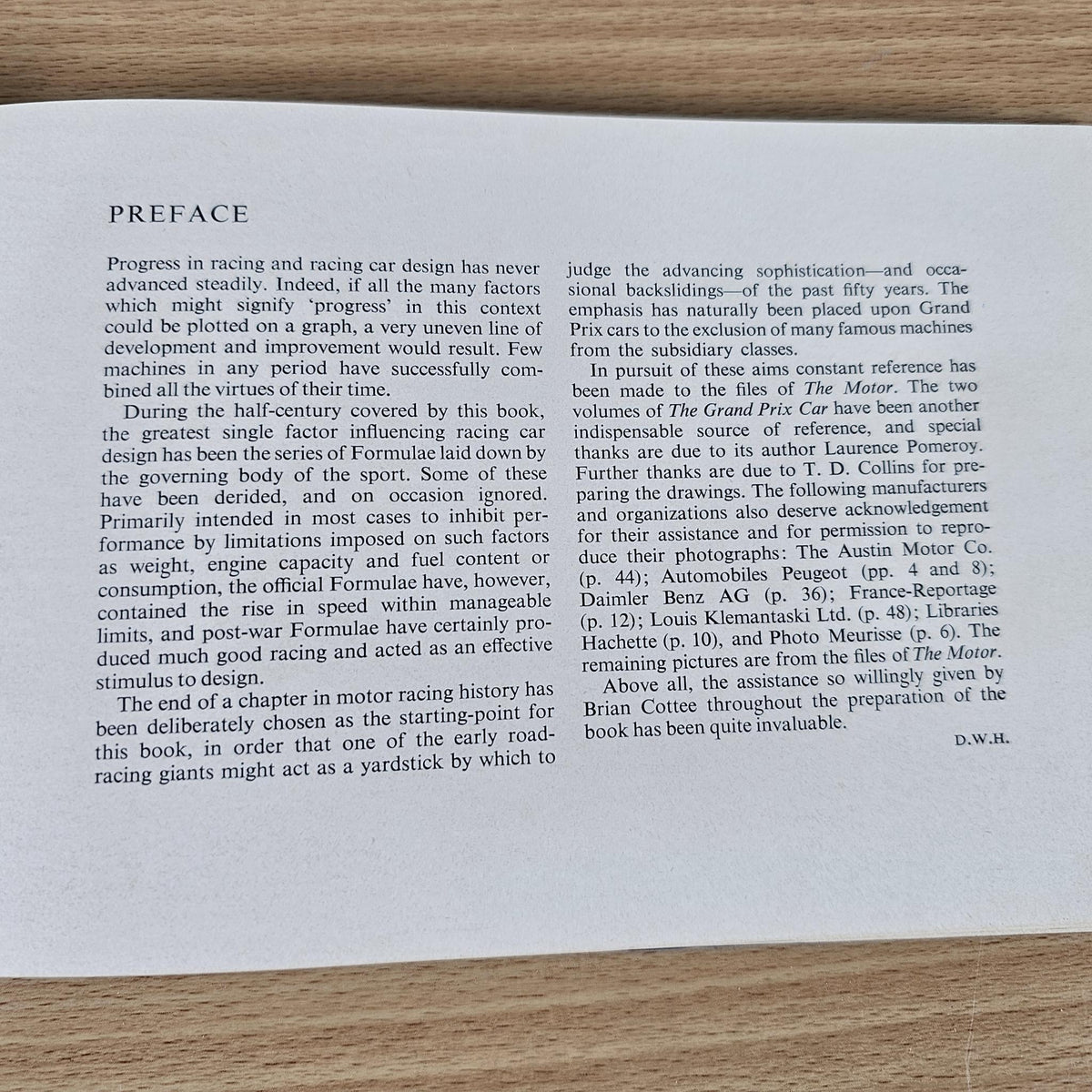 Vintage racing cars book, open to Preface page with typed text.