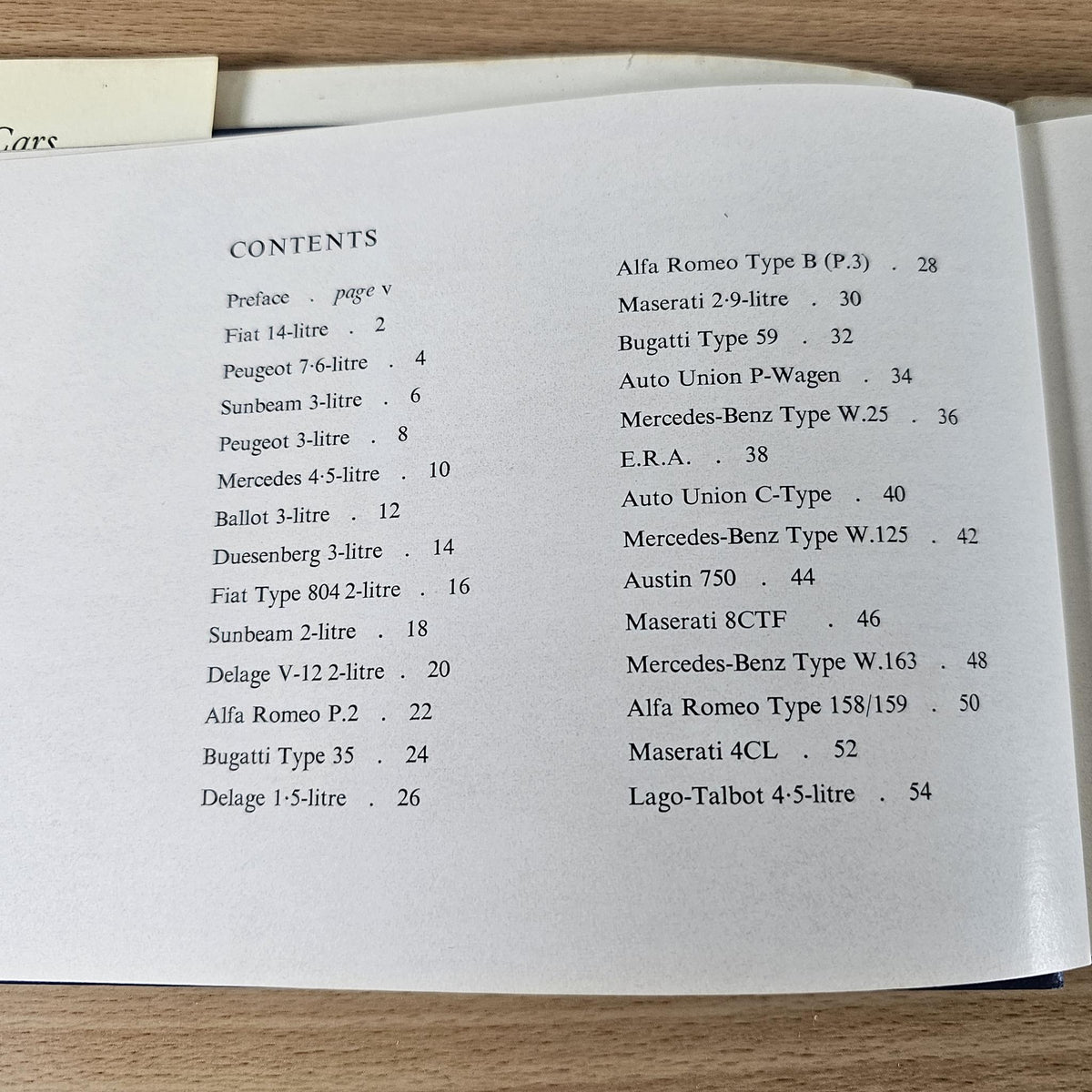 Vintage racing cars book, open to Contents page listing car models and page numbers.