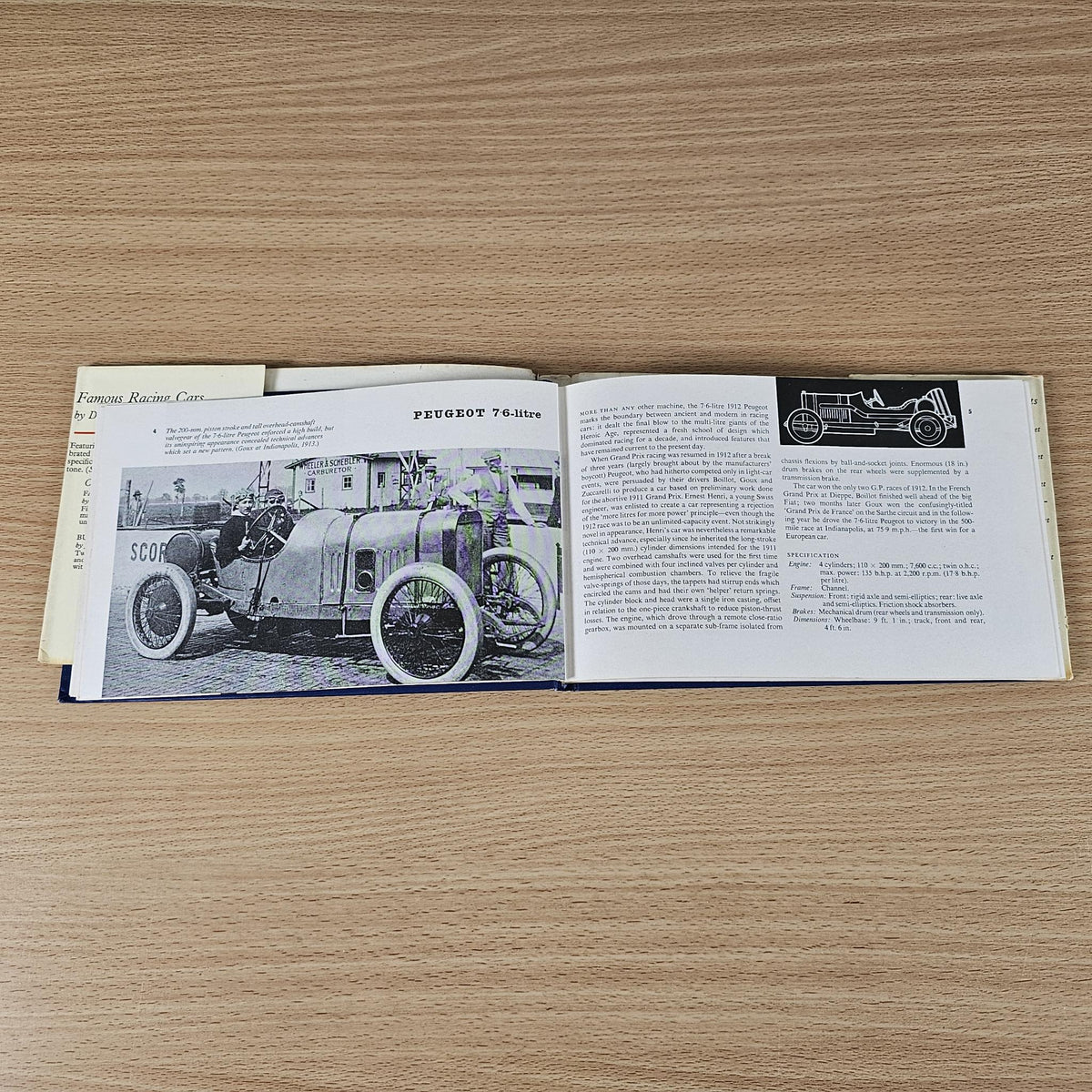 Vintage racing cars book, open spread with classic car photo and technical text.