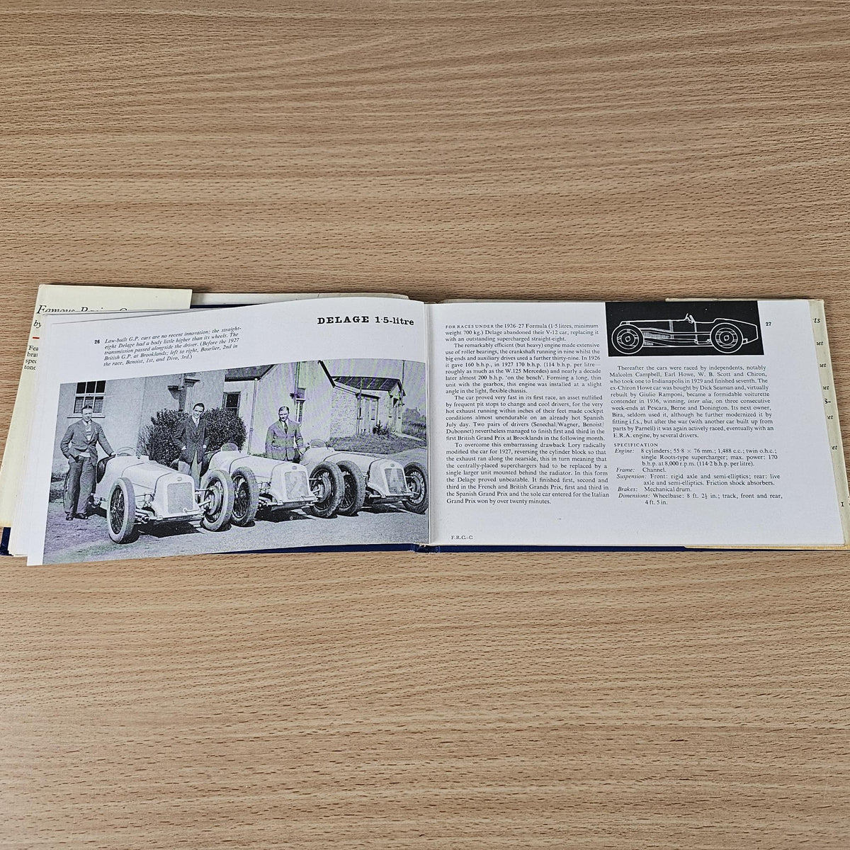 Vintage racing cars book, open spread with vintage car lineup photo and caption text.