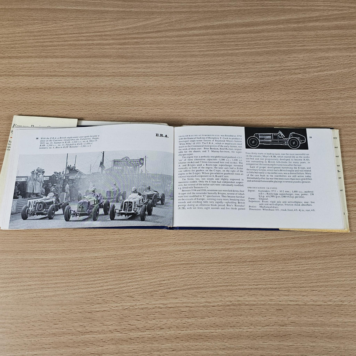 Vintage racing cars book, open spread showing racing cars photo and technical paragraphs.