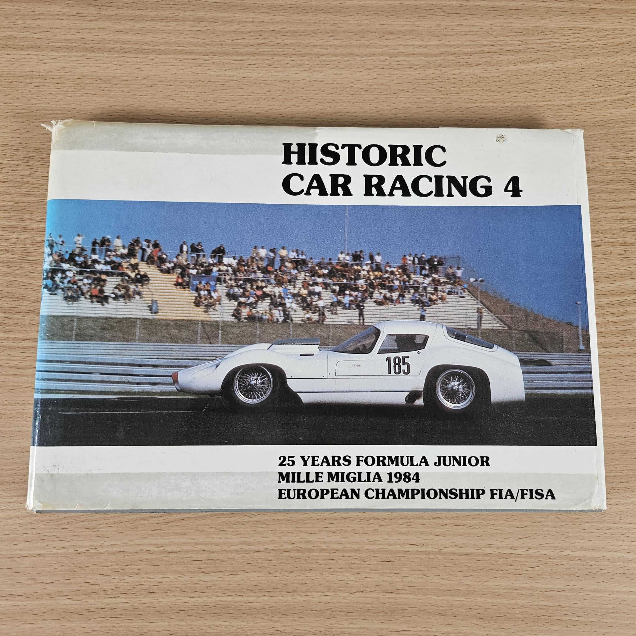Car racing book with cover showing a white race car and event title