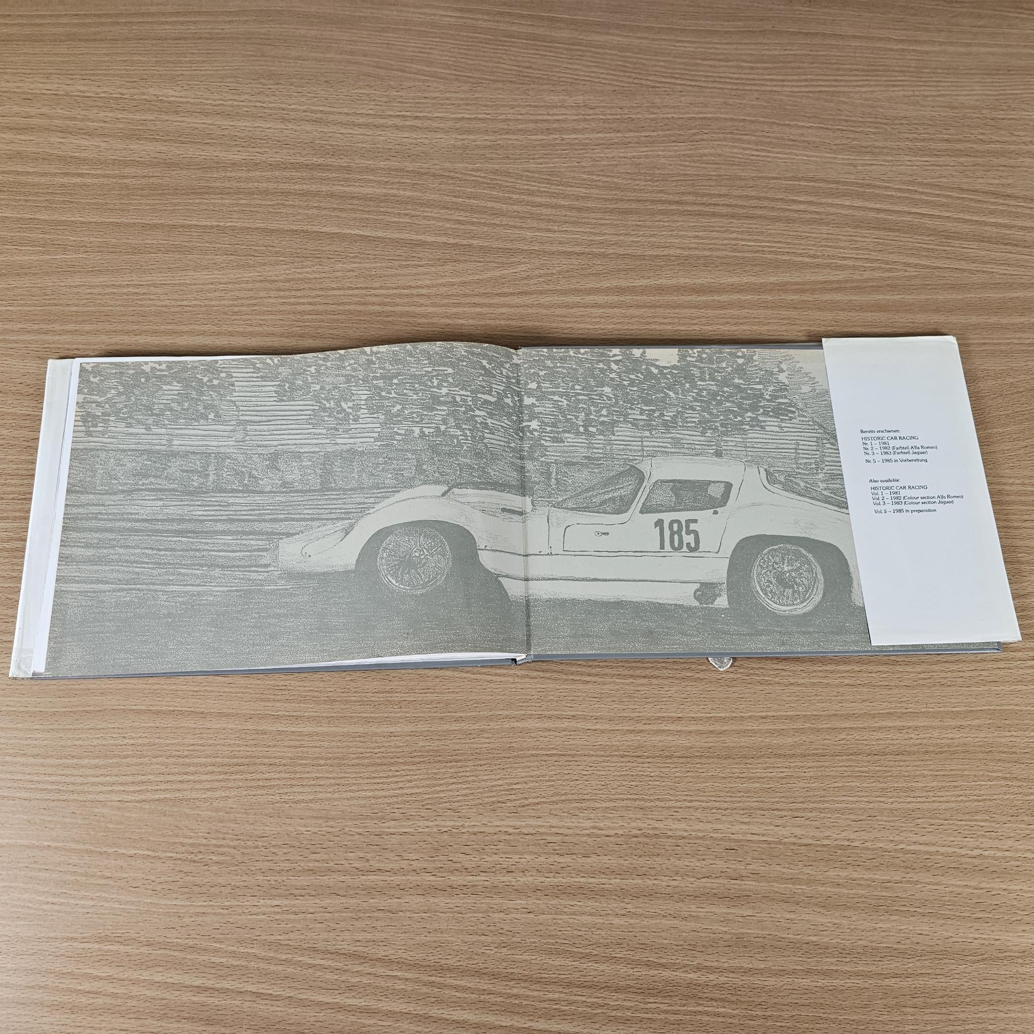 Open book spread featuring a historic race car with number 185 and captions