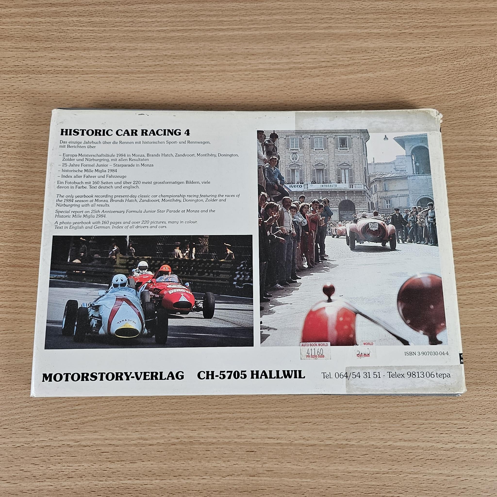 Car racing book back cover with black-and-white race photos and text blocks