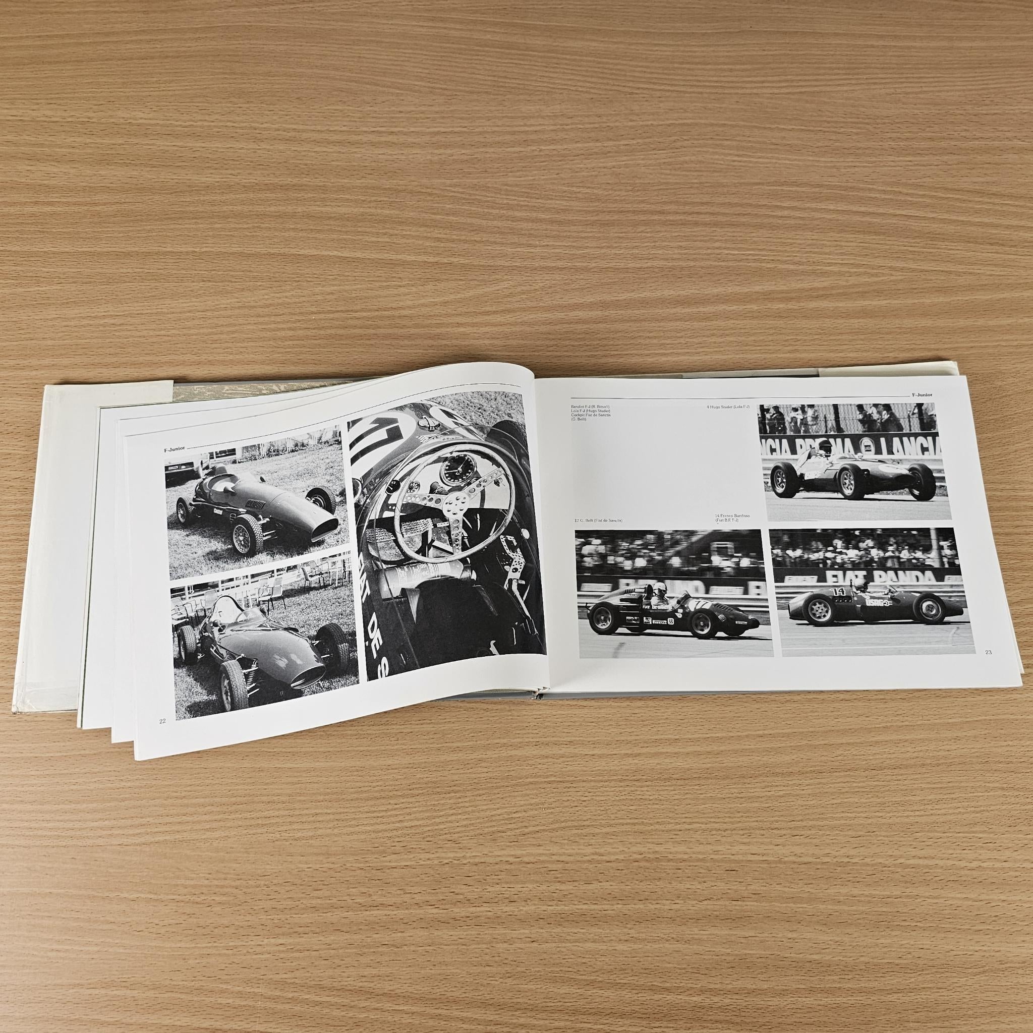Car racing book photo spread with black-and-white race car images