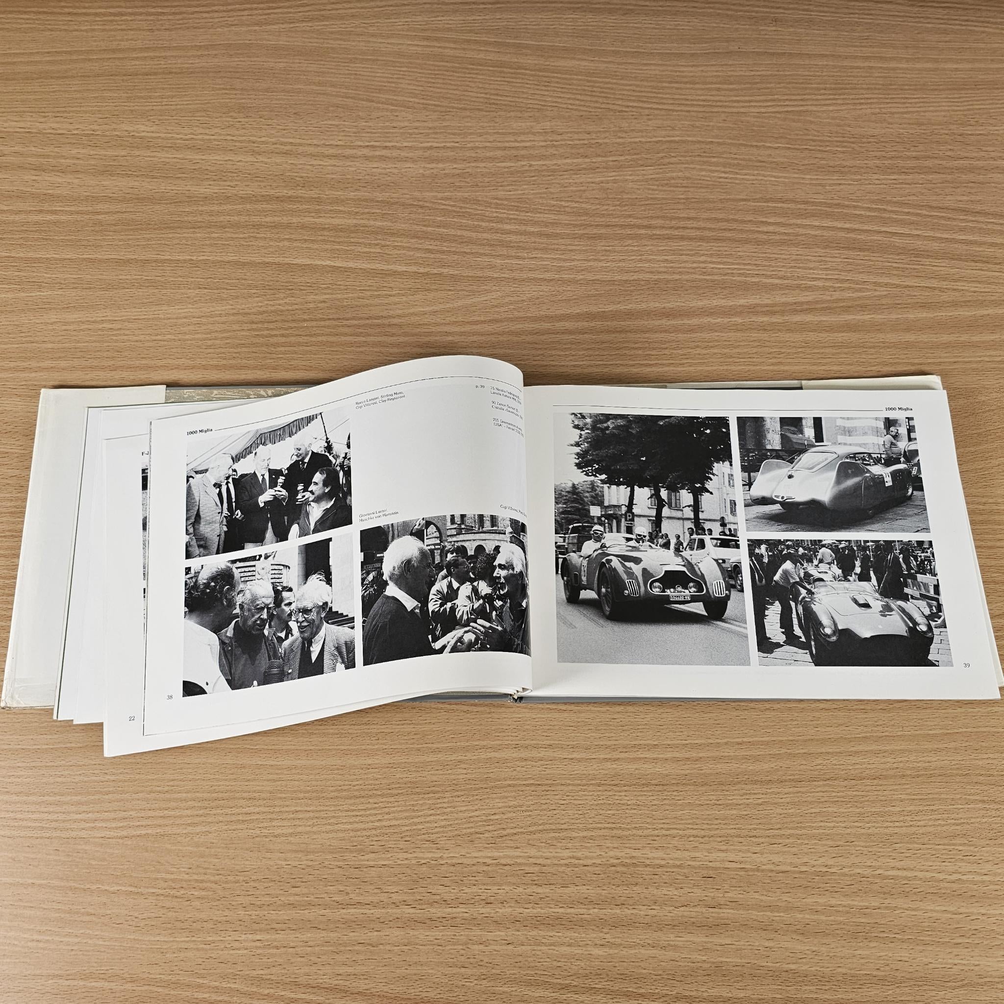 Car racing book open spread with black-and-white race photos on both pages