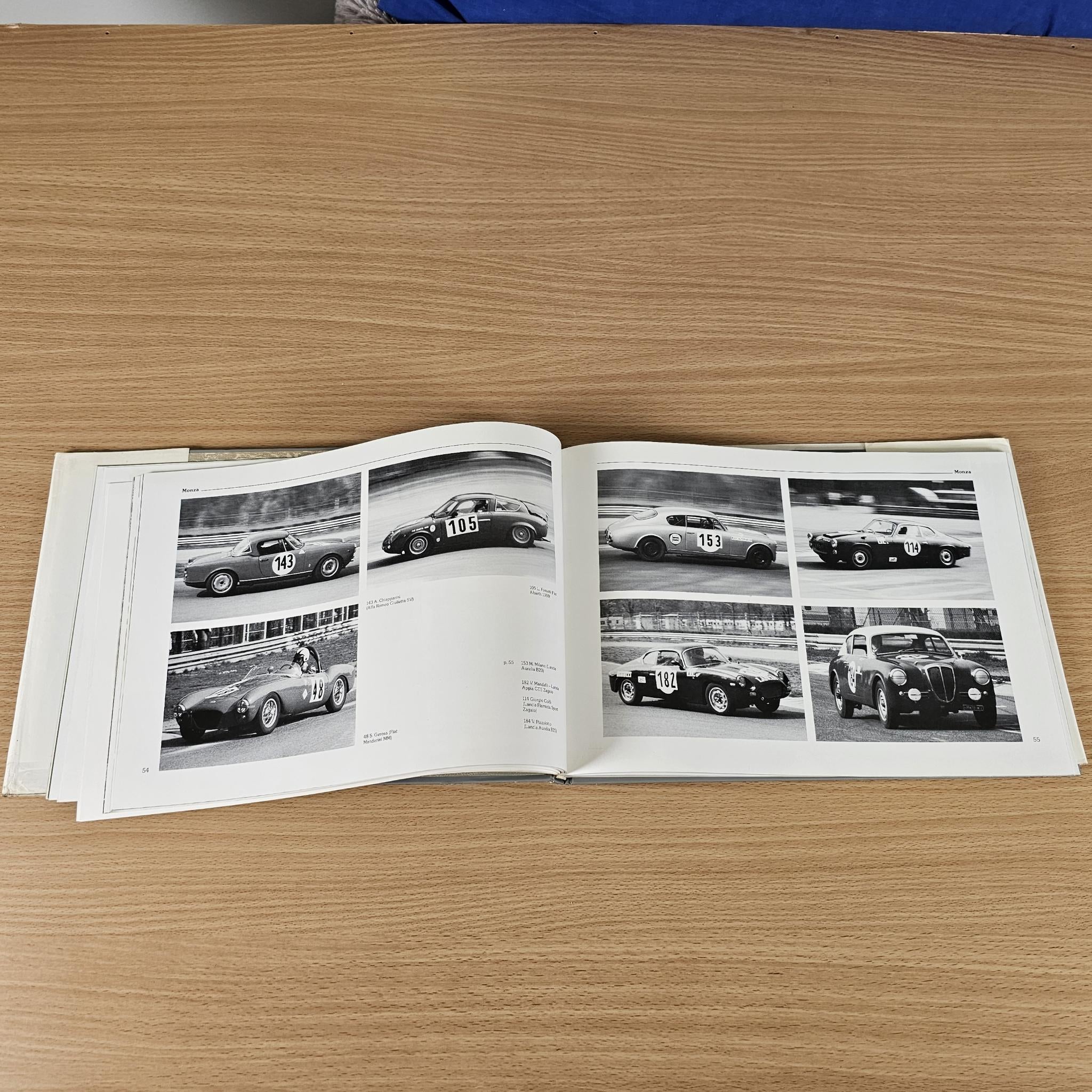 Car racing book photo spread featuring multiple black-and-white race car pictures