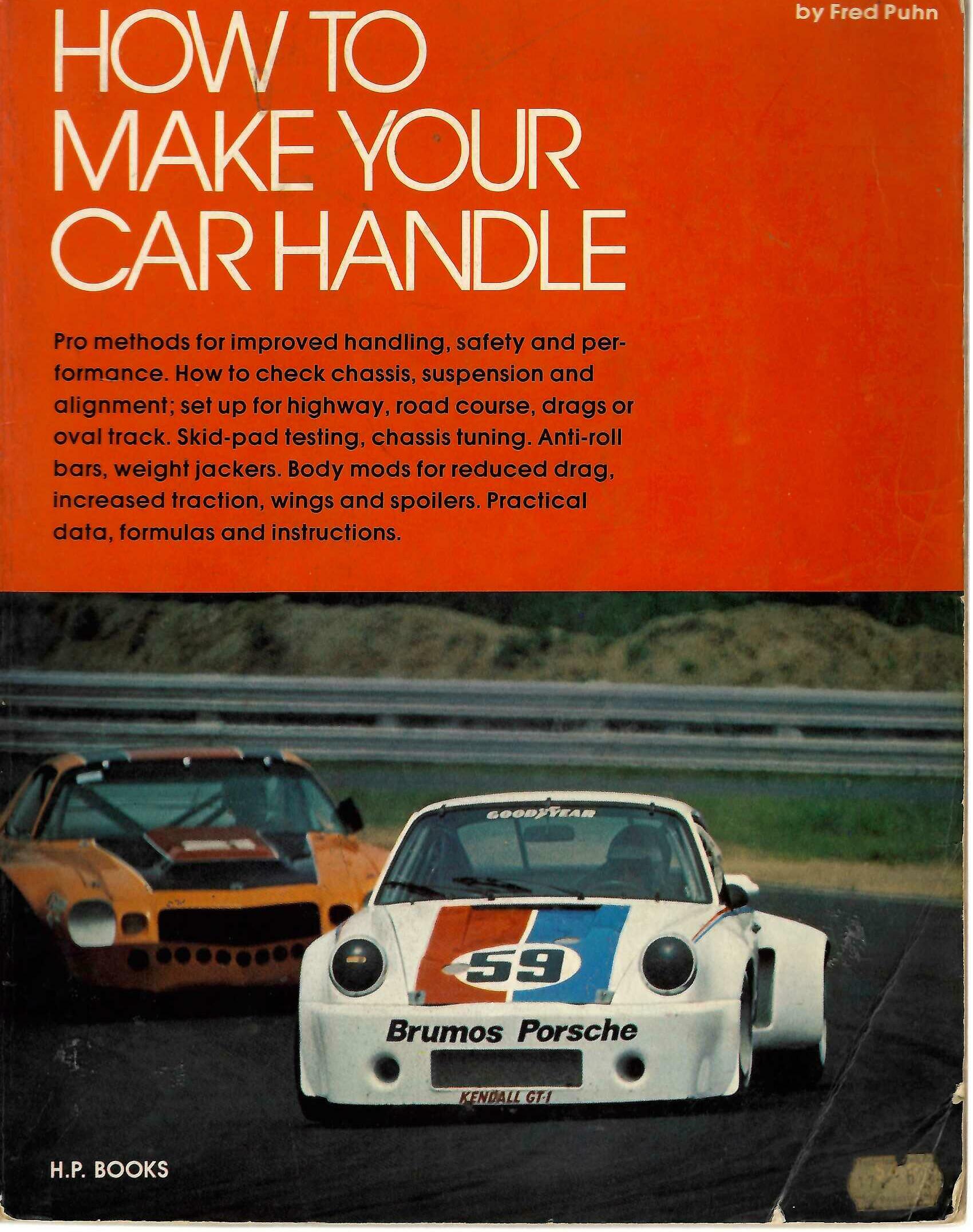 Car handling guidebook with red cover, white title text, and Fred Puhn byline