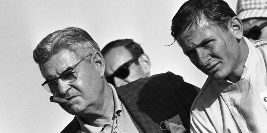 Motorsport photo book spread with three men, black-and-white profile portrait