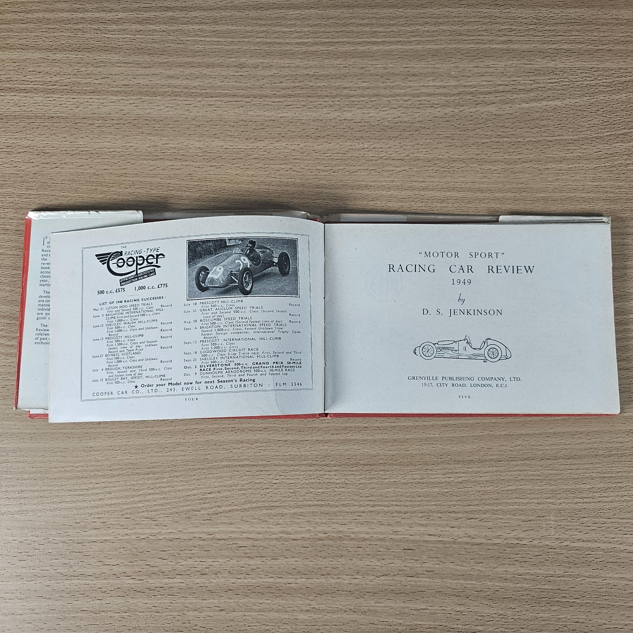 Open vintage book page spread with race car photo, text blocks, and car lineup.