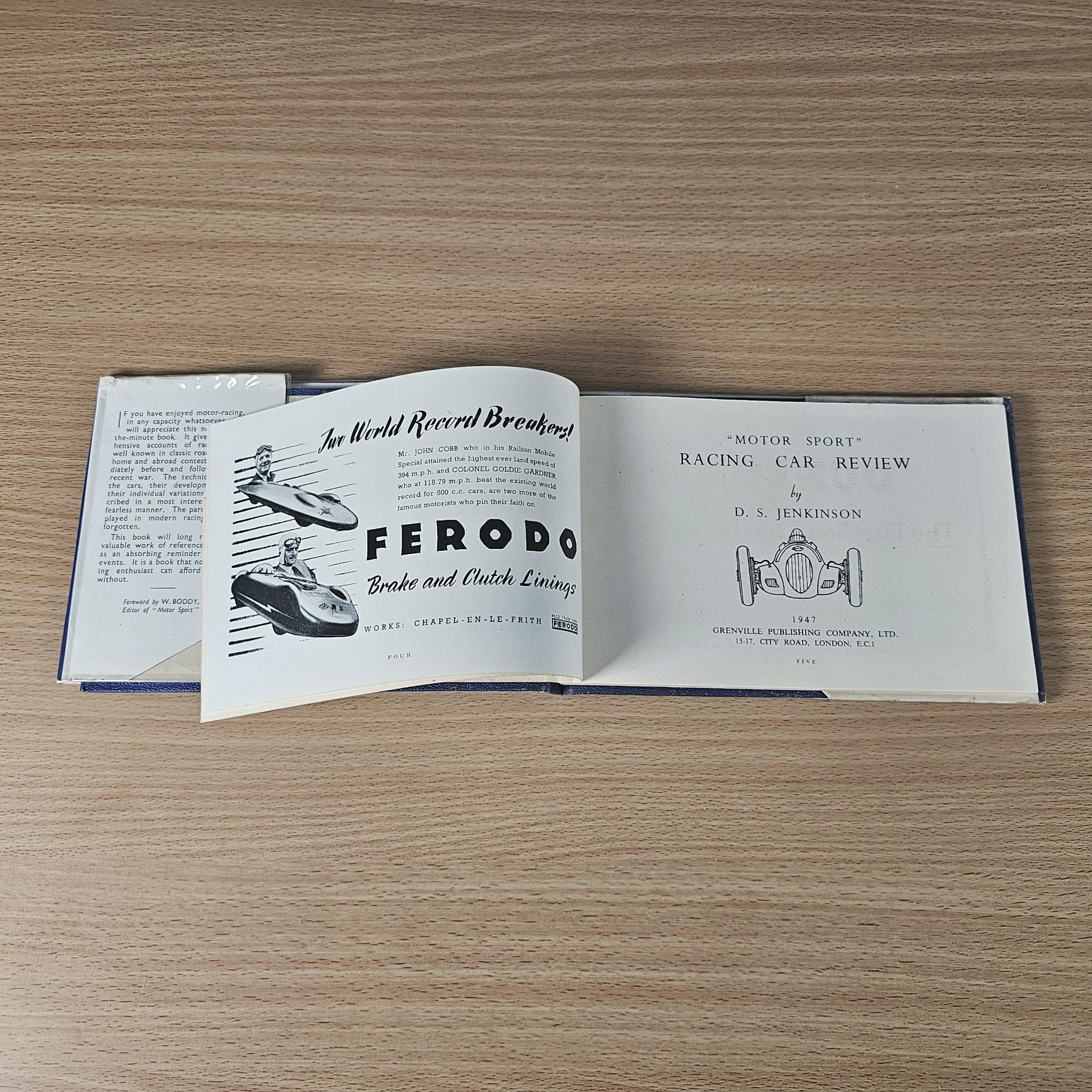Racing car review book open, cover pages featuring “FERODO” and technical headings