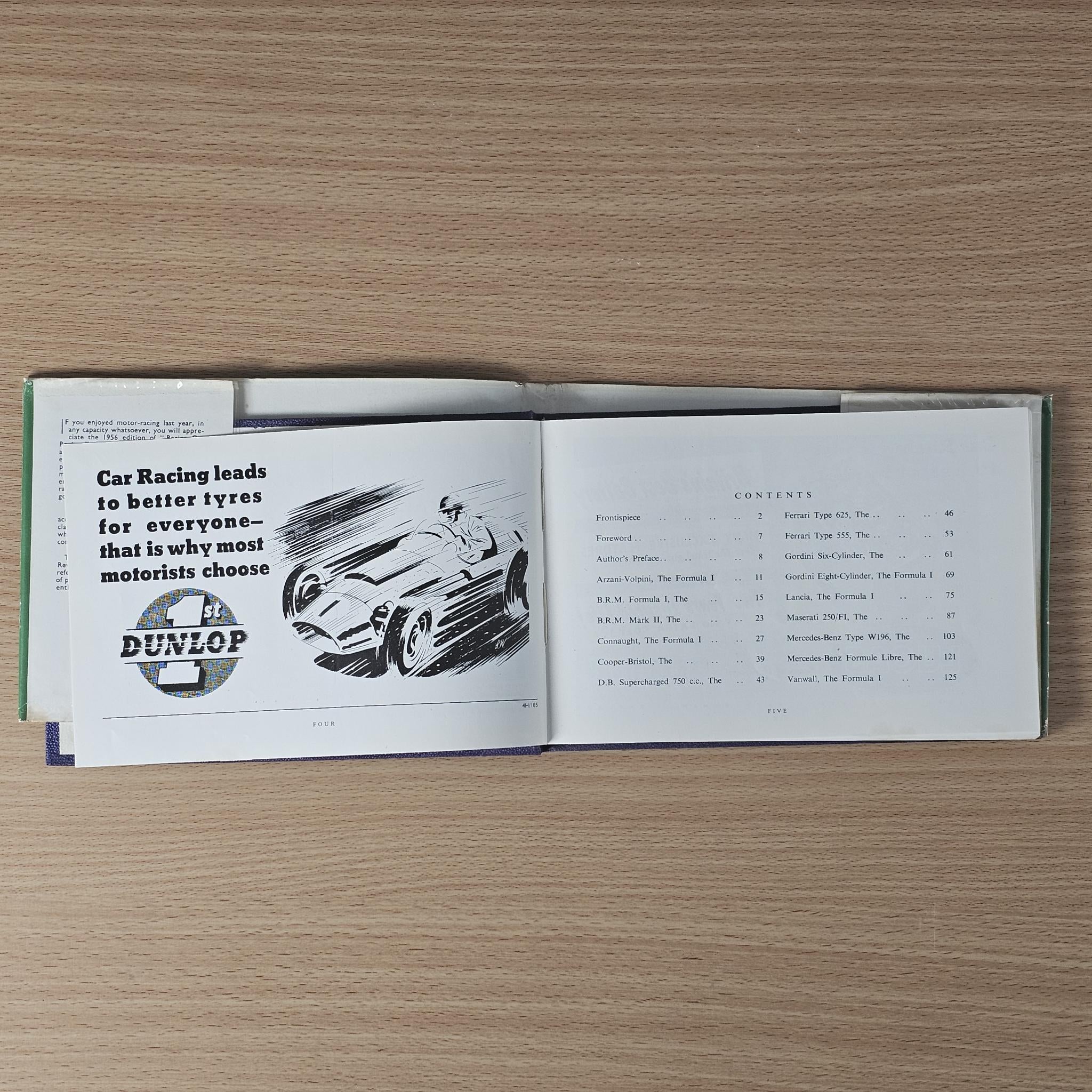 Vintage racing car review book, open spread with black-and-white engine illustration and text
