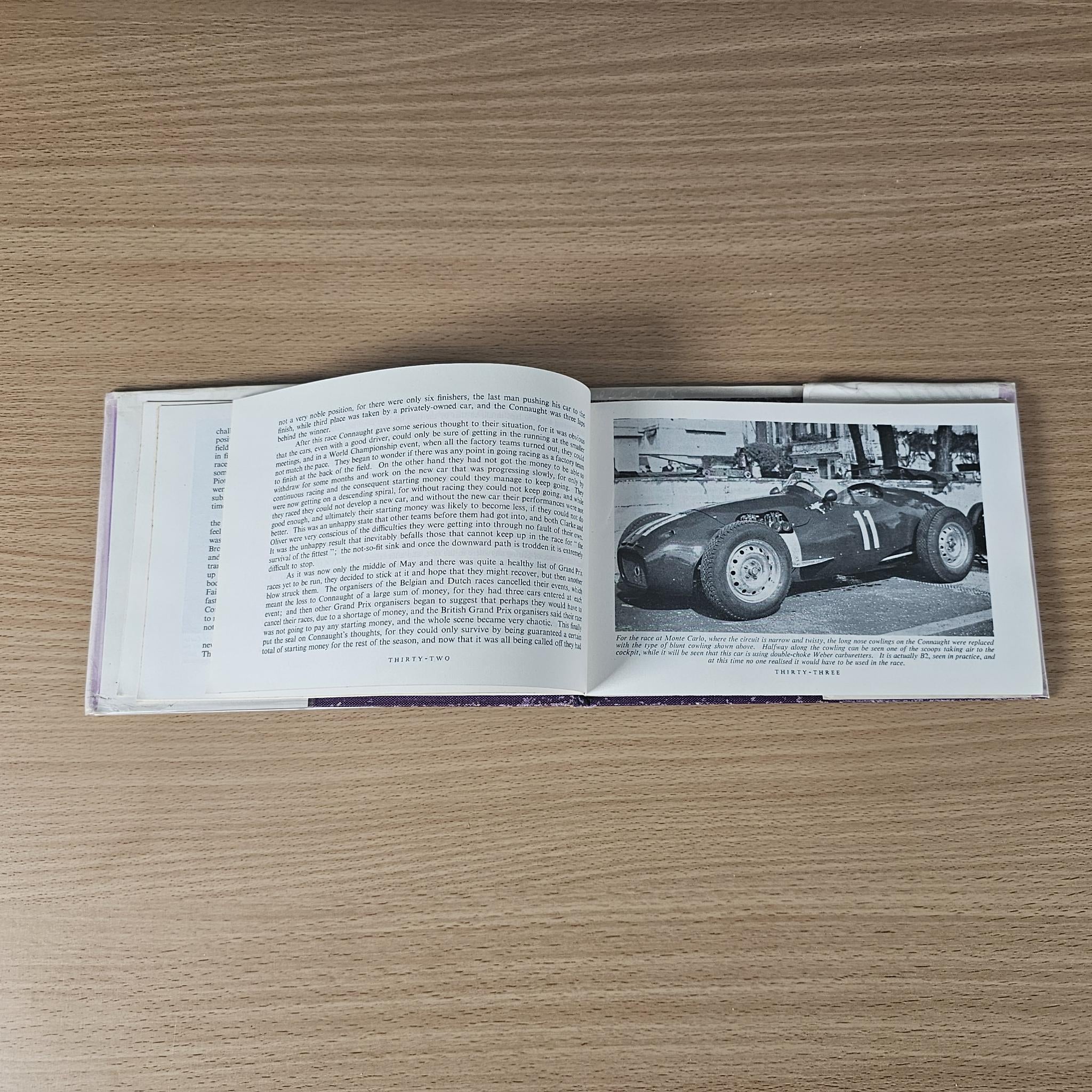 Open 1958 racing car review book showing text and black-and-white race car photo