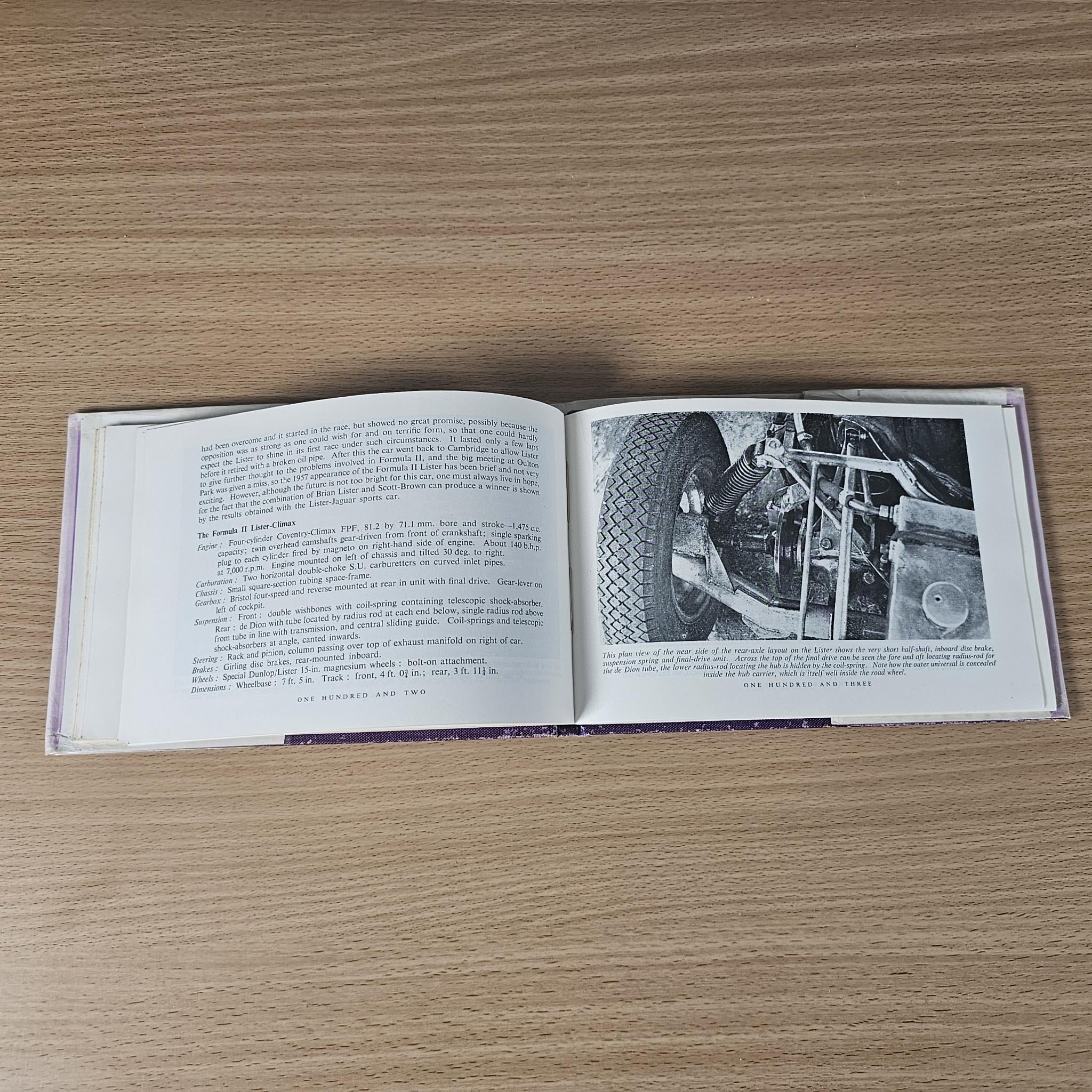 Open 1958 racing car review book with text and black-and-white photo of engine components