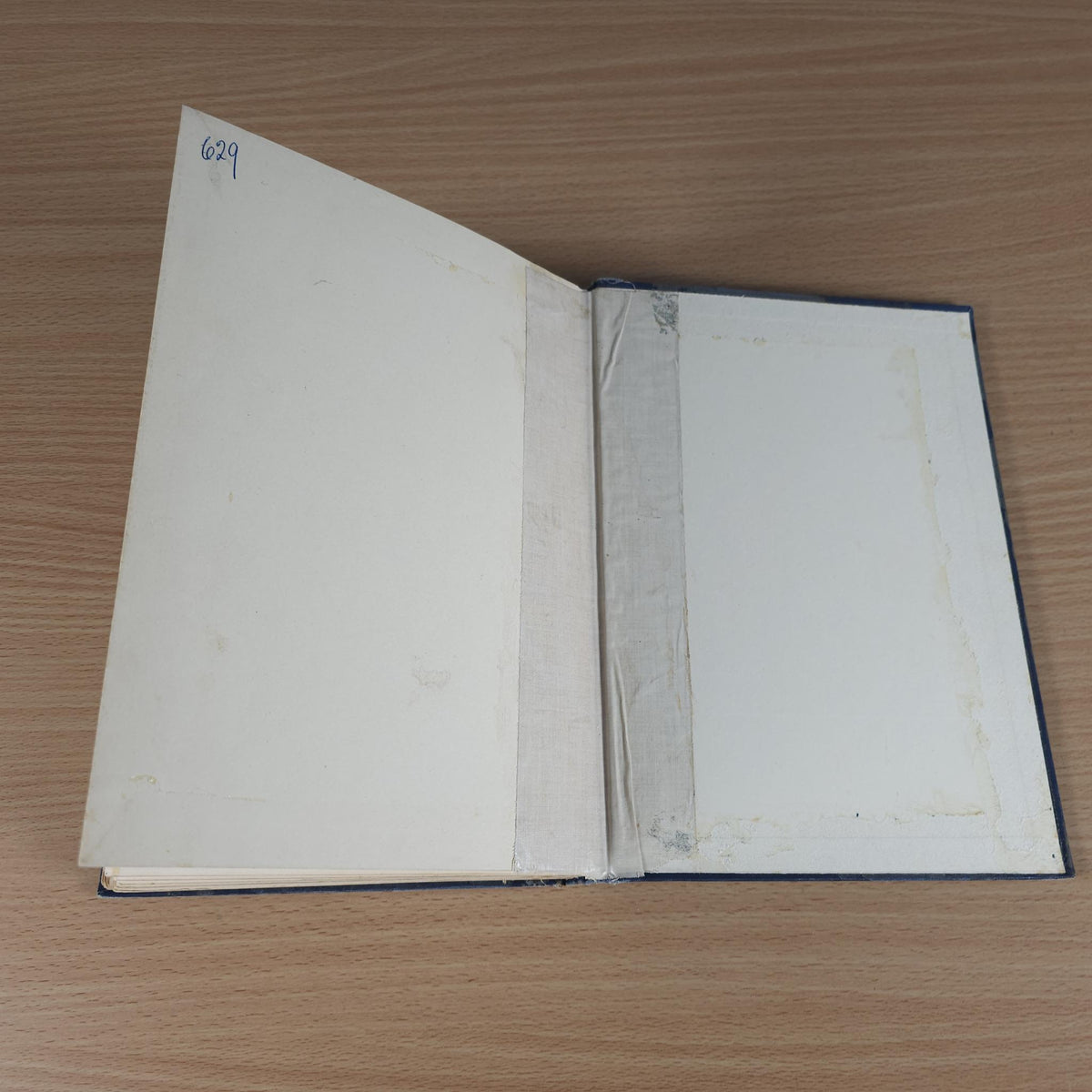 Vintage racing book, open with blank pages and page number '629' on the left sheet