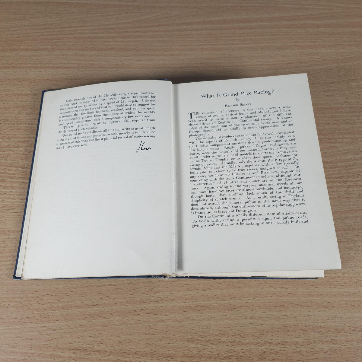 Vintage racing book open to a section titled 'What is Grand Prix Racing'