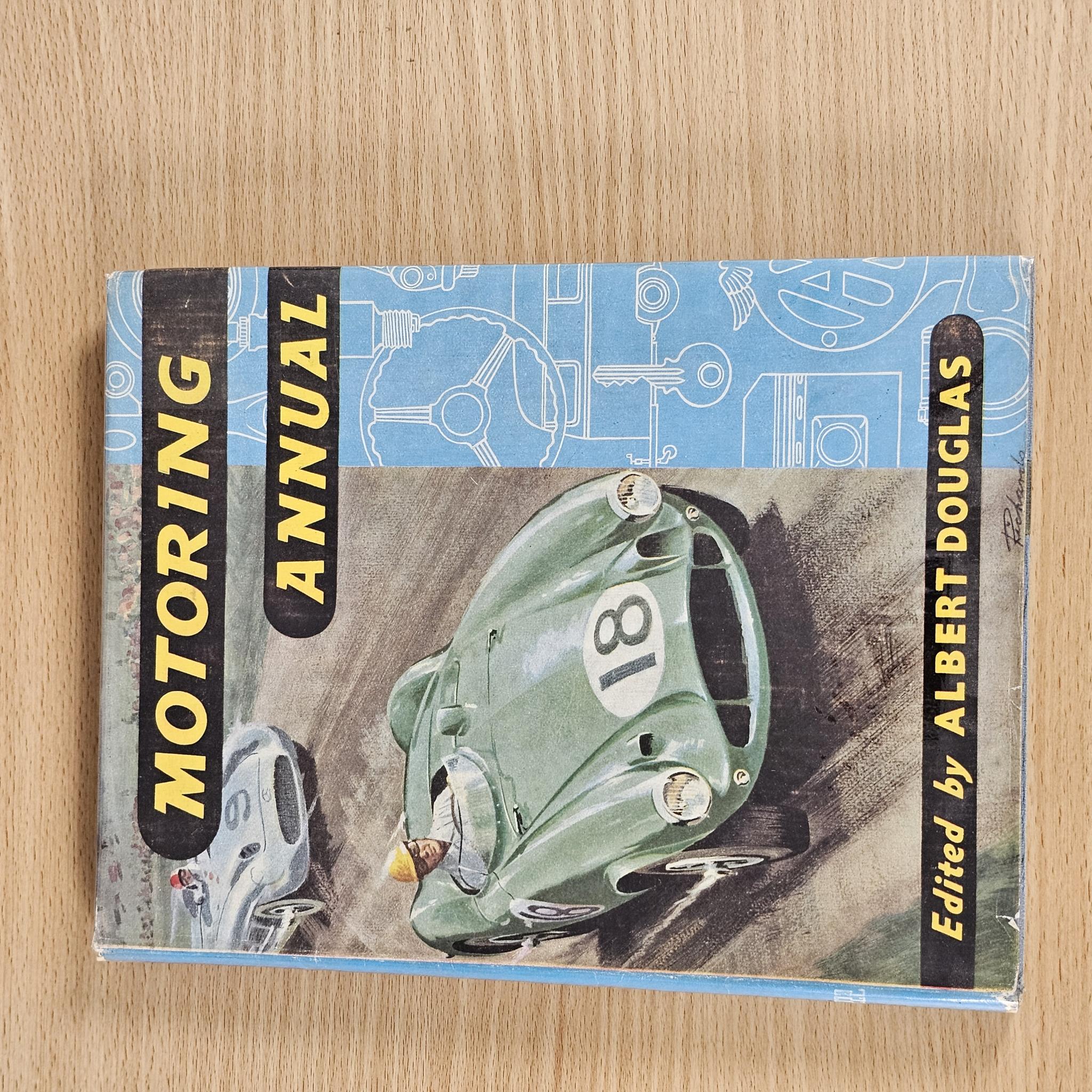 Motoring Annual book with illustrated cover showing classic cars, title, and editor name