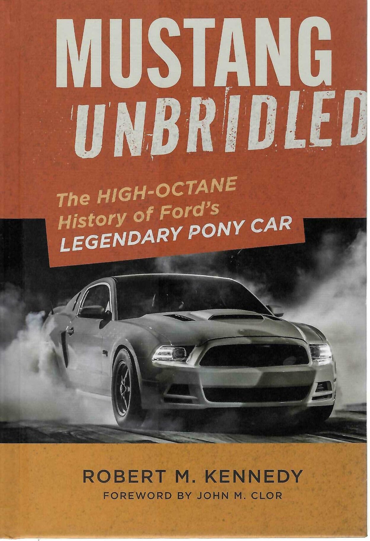 Hardcover auto history book cover with title and classic gray sports car photo