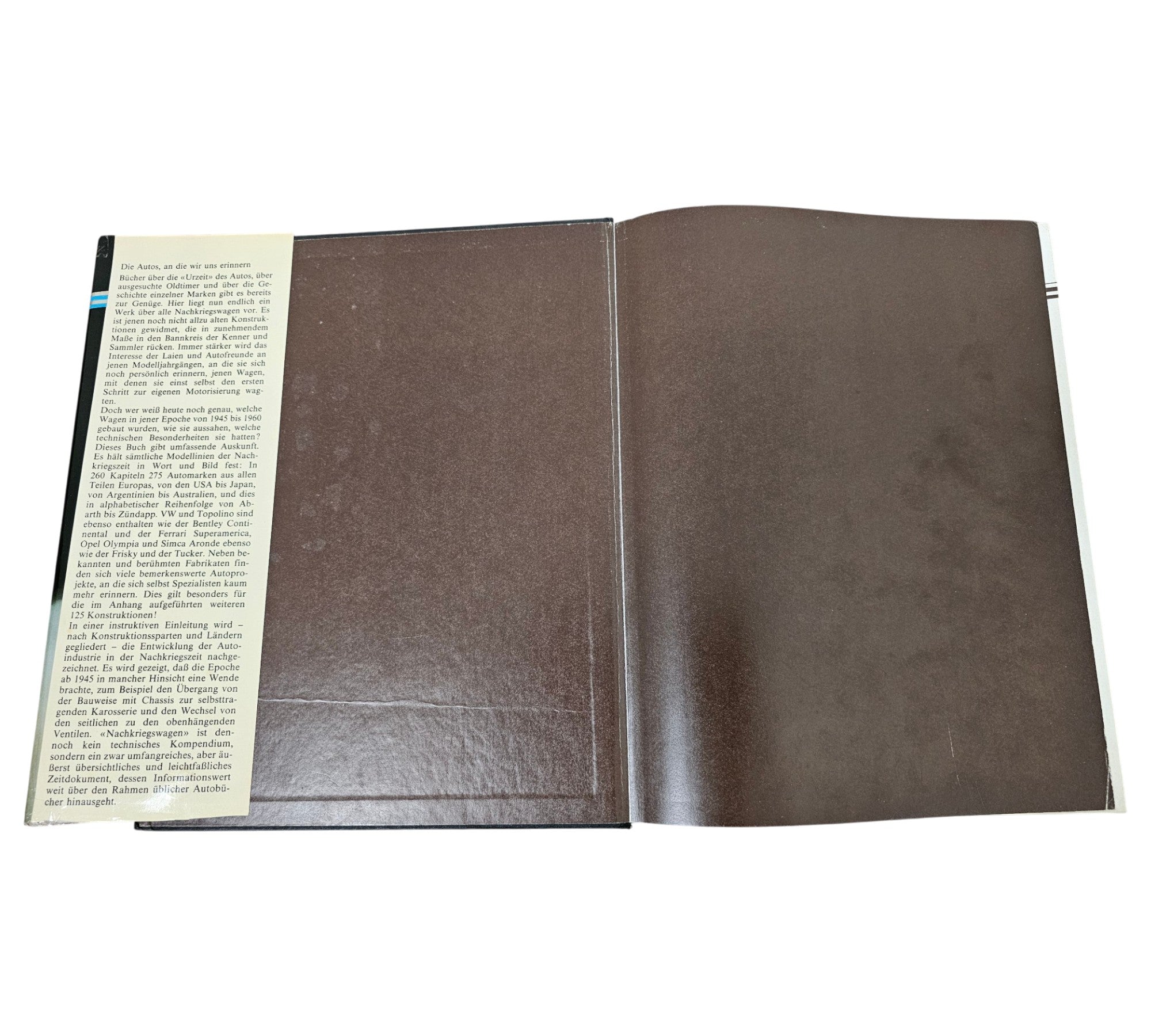 Vintage automotive reference book, open spread with brown pages and text on one side