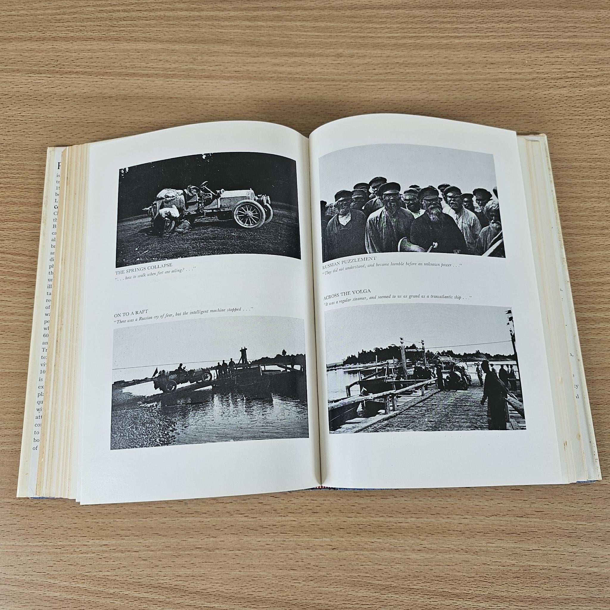 Hardcover book open to black-and-white photo pages