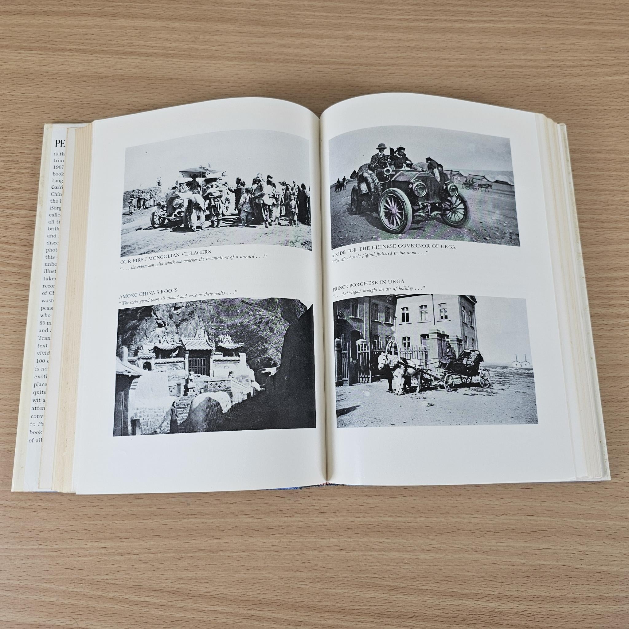 Hardcover book open to photo spread with four black-and-white images and captions