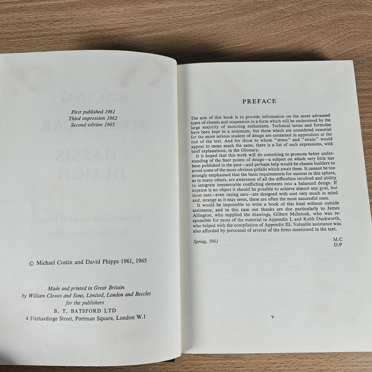 Open hardcover book showing preface page with printed text and author line