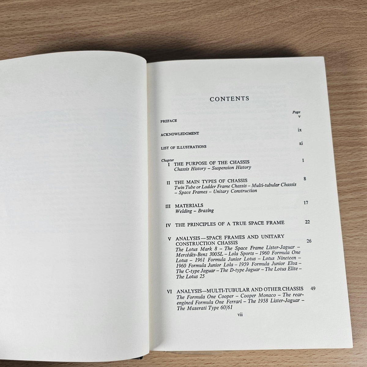 Open hardcover book displaying contents page with section list