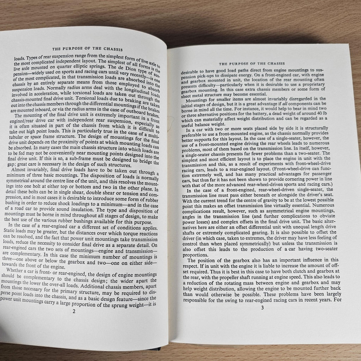 Open hardcover book with two pages of printed engineering text