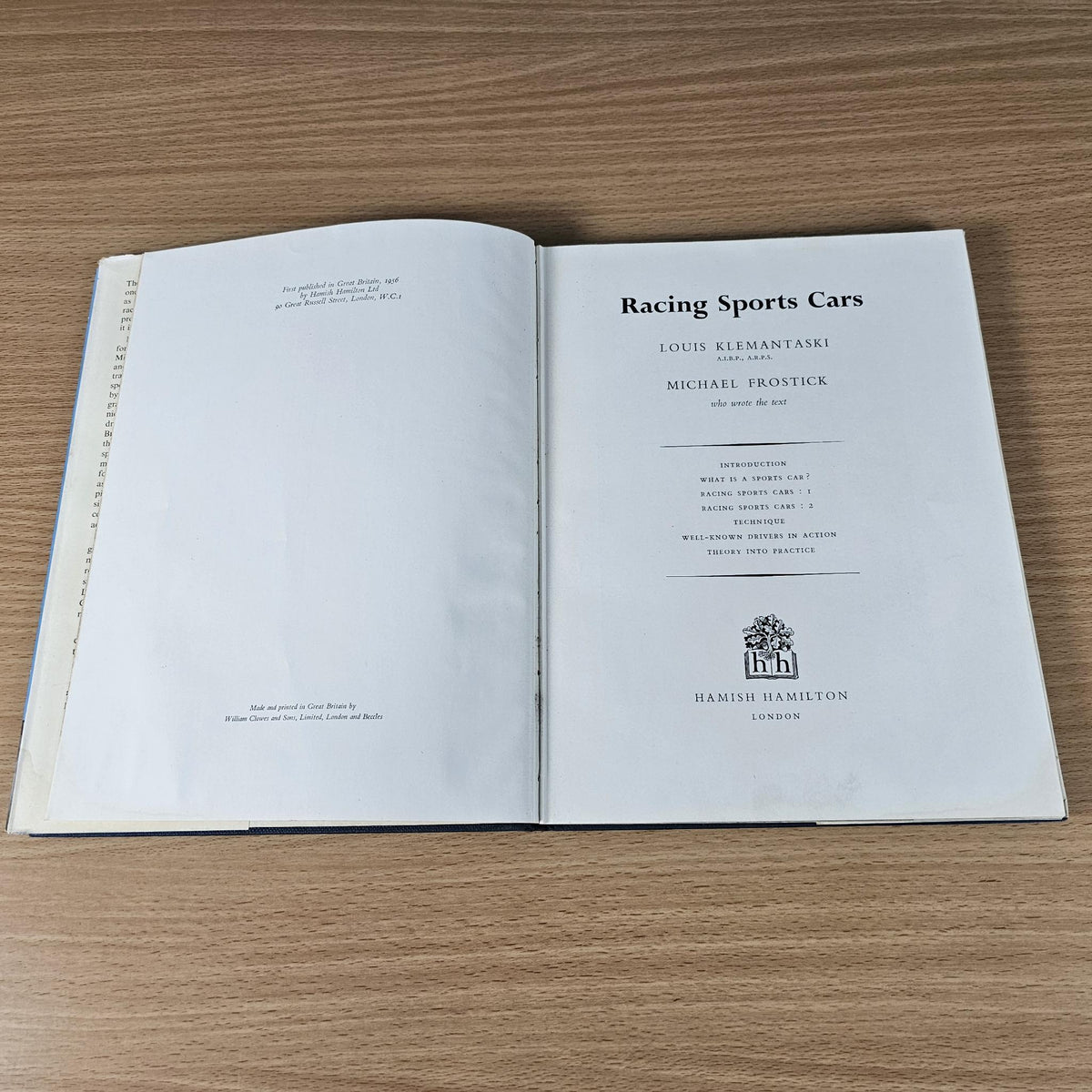 Vintage hardcover racing sports cars book opened to title page with “Hamish Hamilton” logo