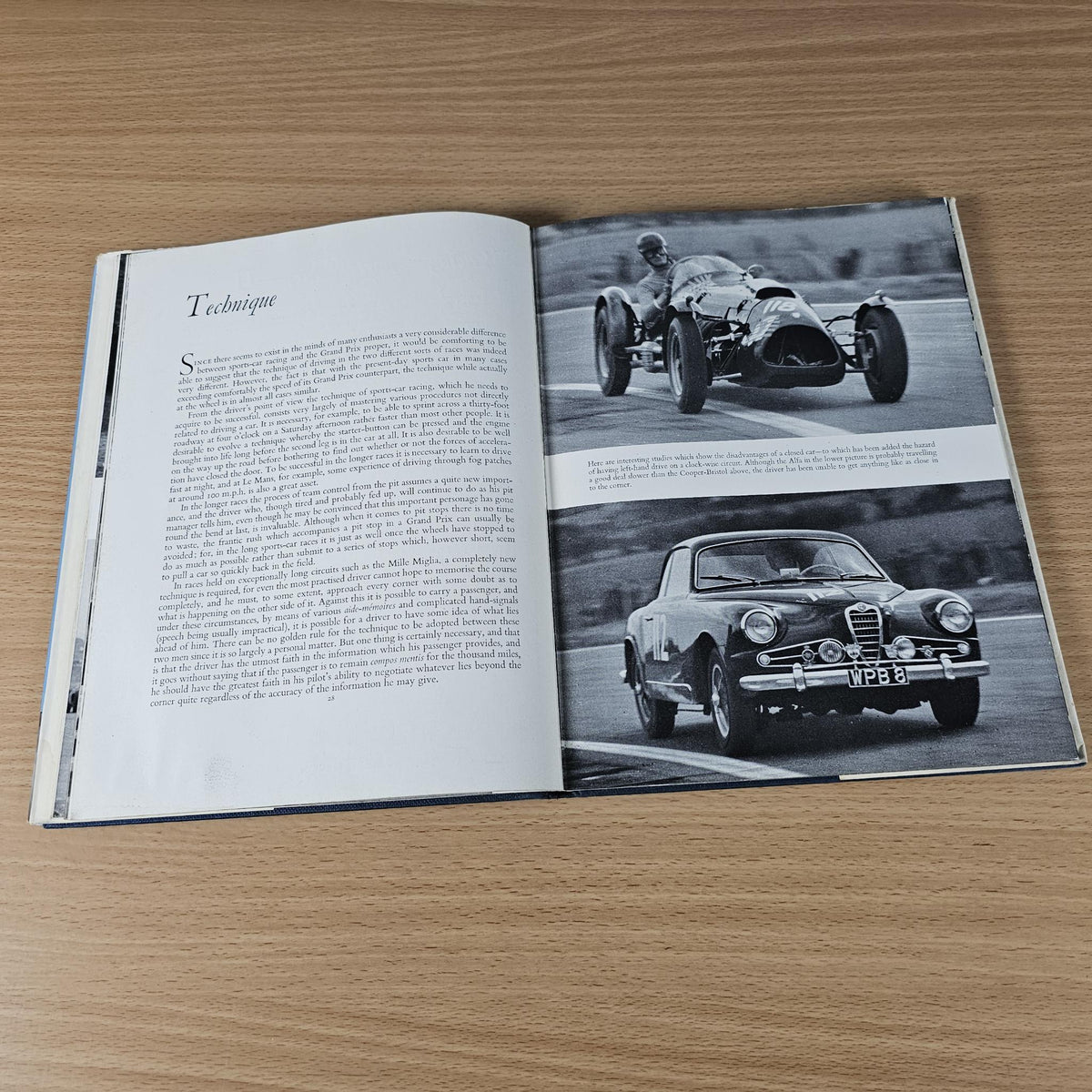 Vintage racing sports cars book open to detail pages with two black-and-white car photos