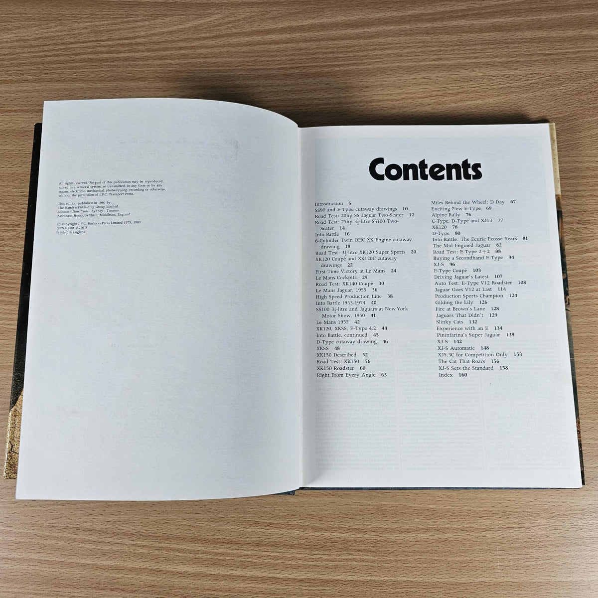 Open vintage car book showing right-page contents list under the word "Contents"
