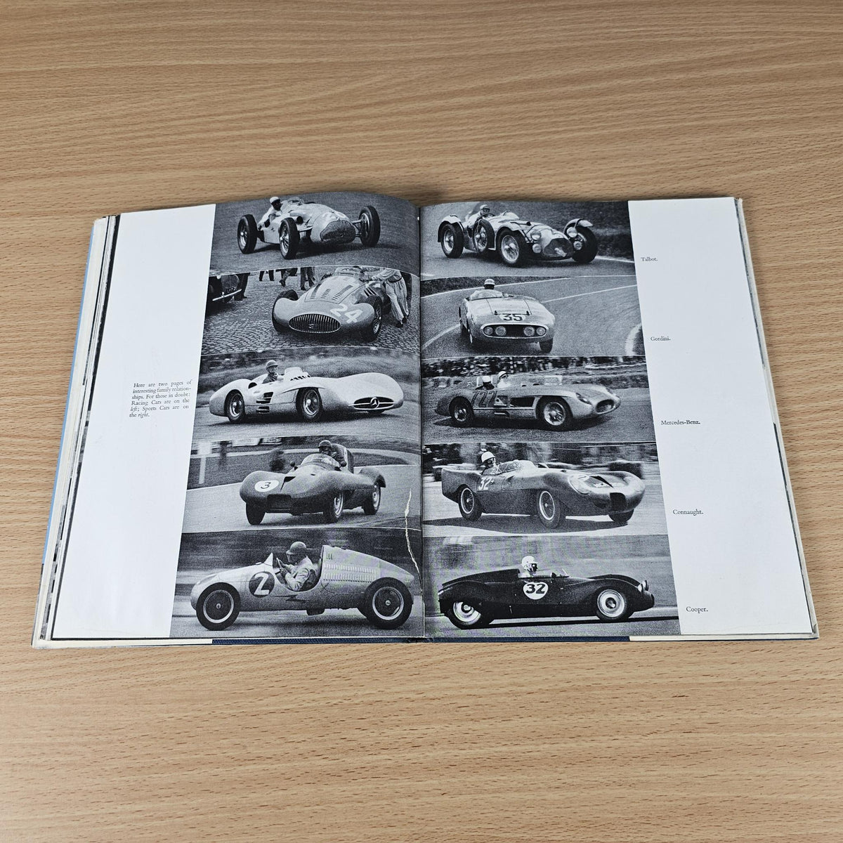 Open vintage racing sports cars book featuring a grid of black-and-white car photographs