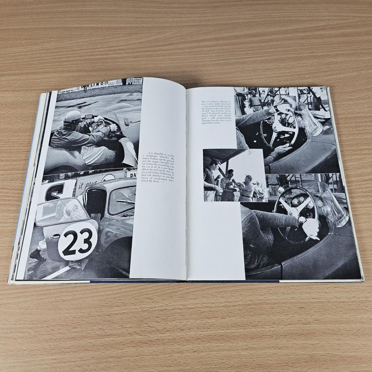 Vintage racing sports cars book open to pages with black-and-white photos of drivers and cars