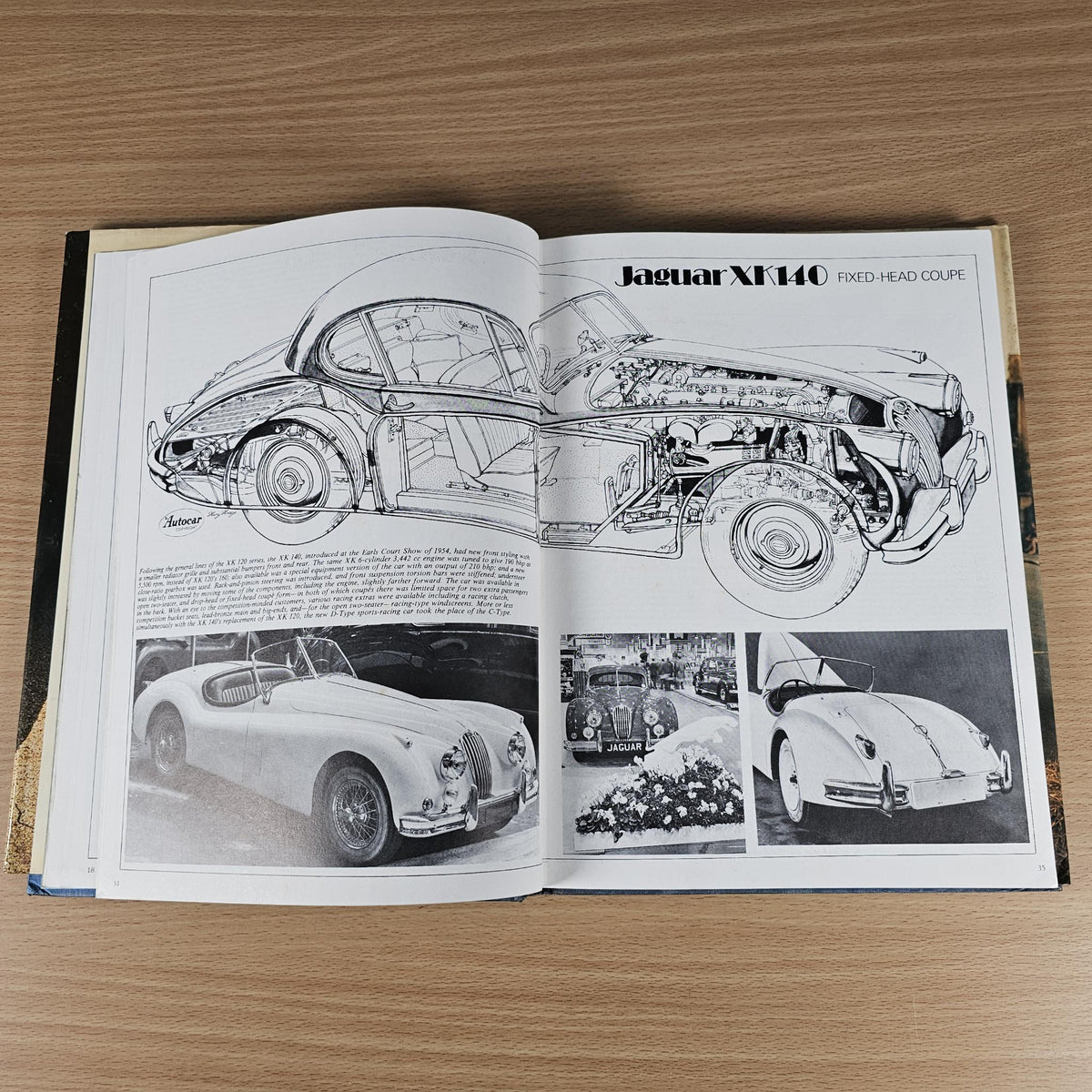 Open Jaguar Sports book spread with Jaguar XK140 technical line drawings and photos