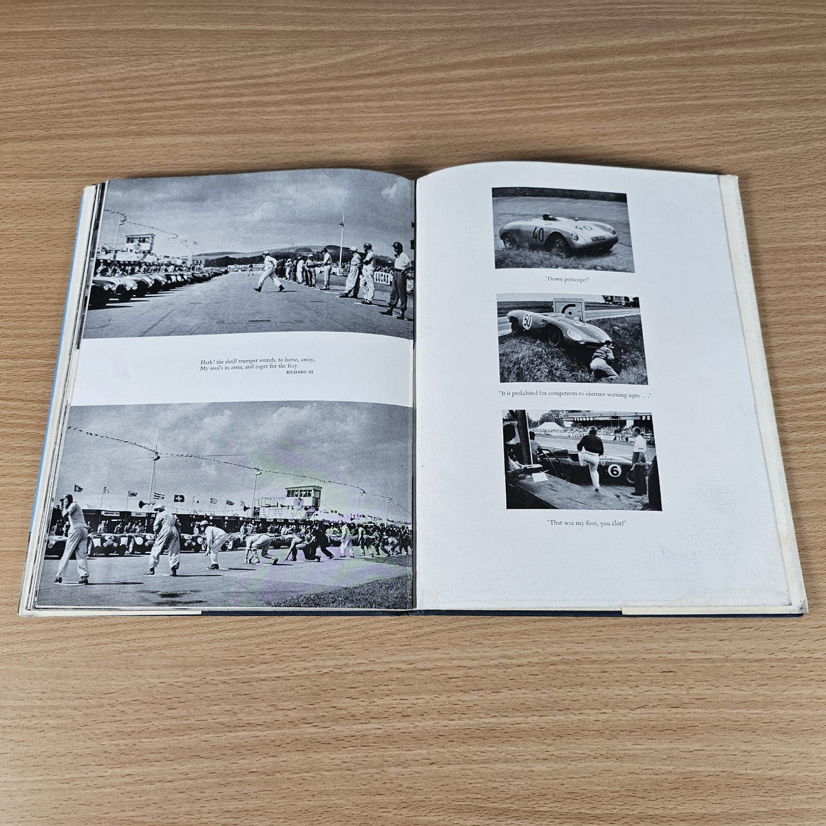 Vintage racing sports cars book open to pages with small black-and-white car photo inserts