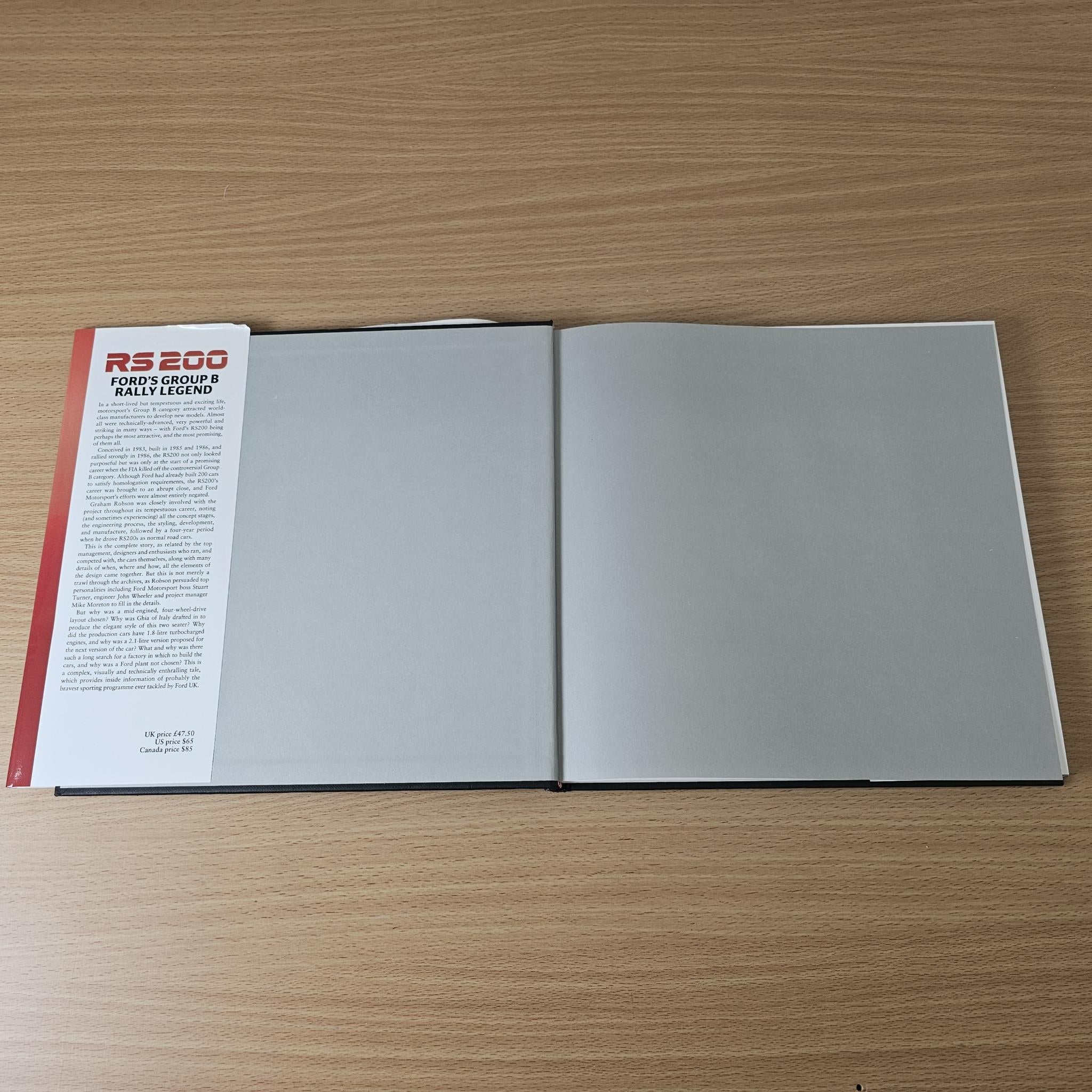 Open rally book with white pages, gray page section, and small red header text.