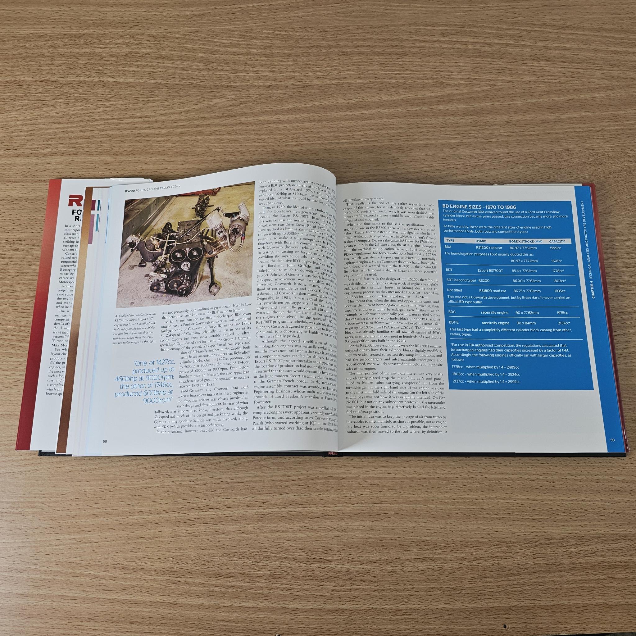 Open rally book with engine photo on the left page and blue text box on right.
