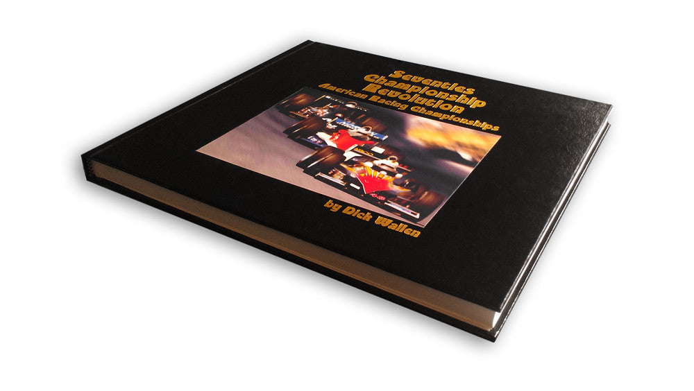 Racing championship book with black cover and centered car photo, angled view