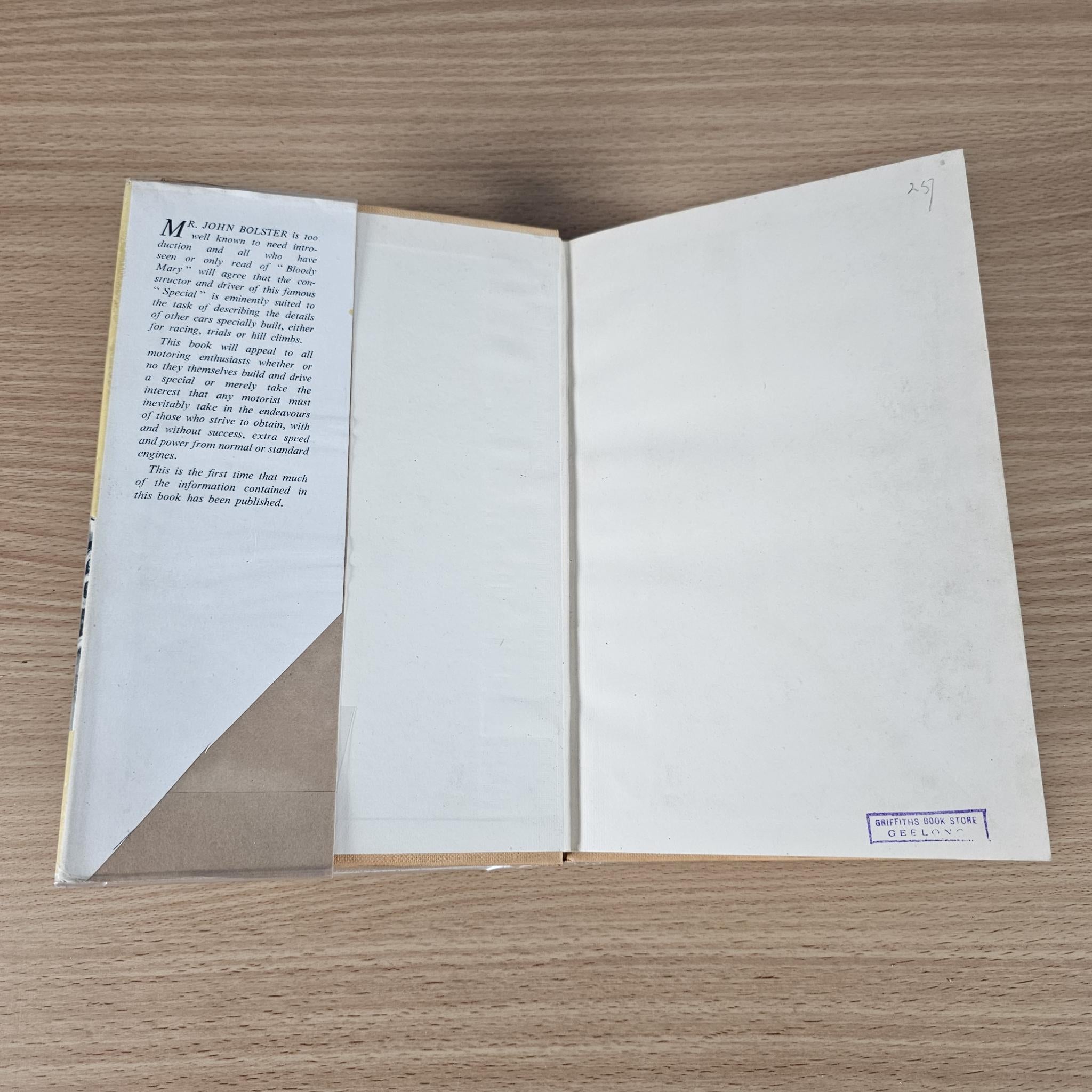 Open racing book with blank white pages and a small publisher label at bottom