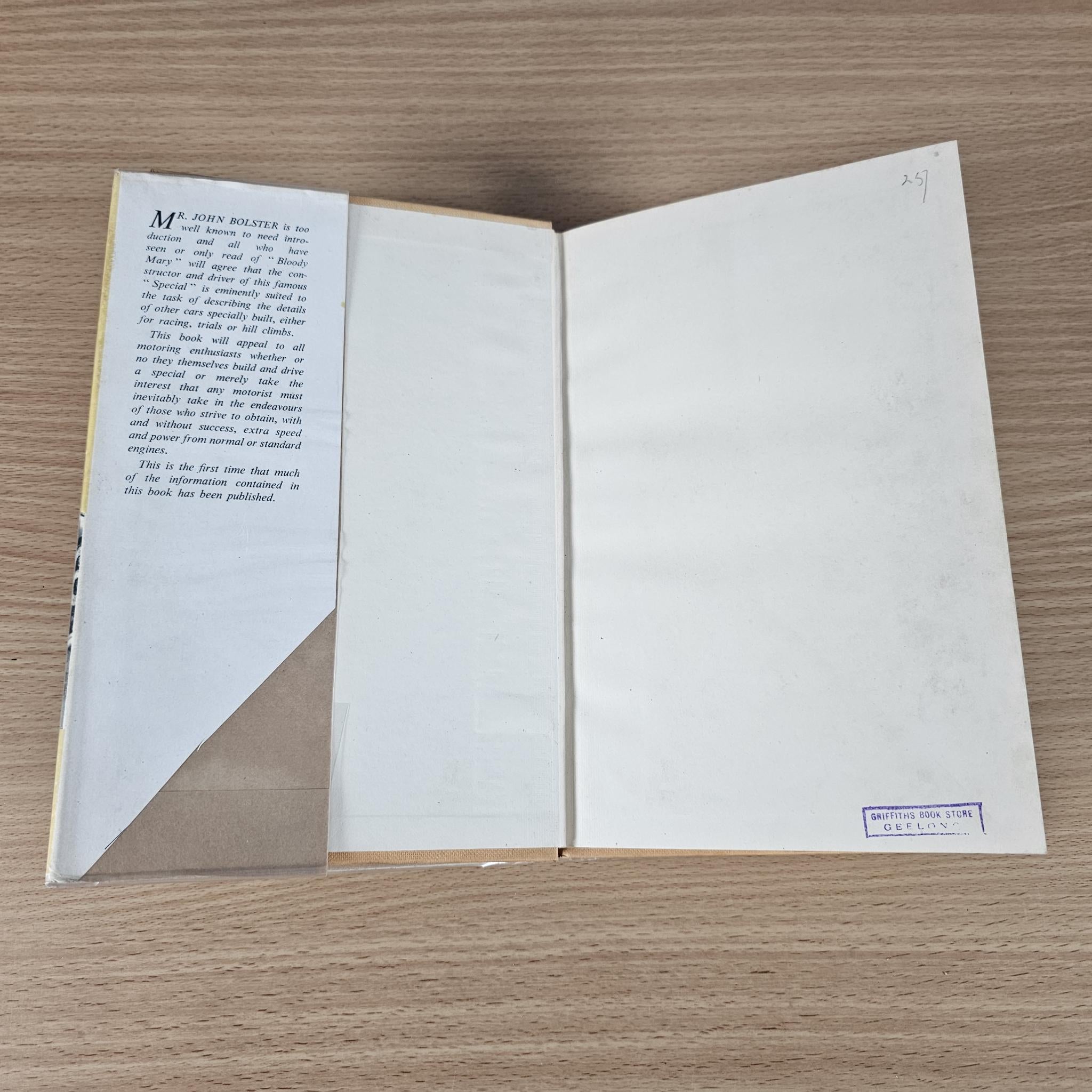 Open racing book showing two blank pages and a small label on the bottom right